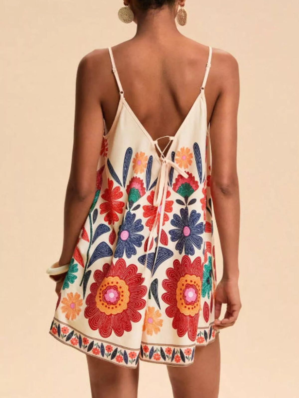 Red floral print spaghetti strap romper full length styled view