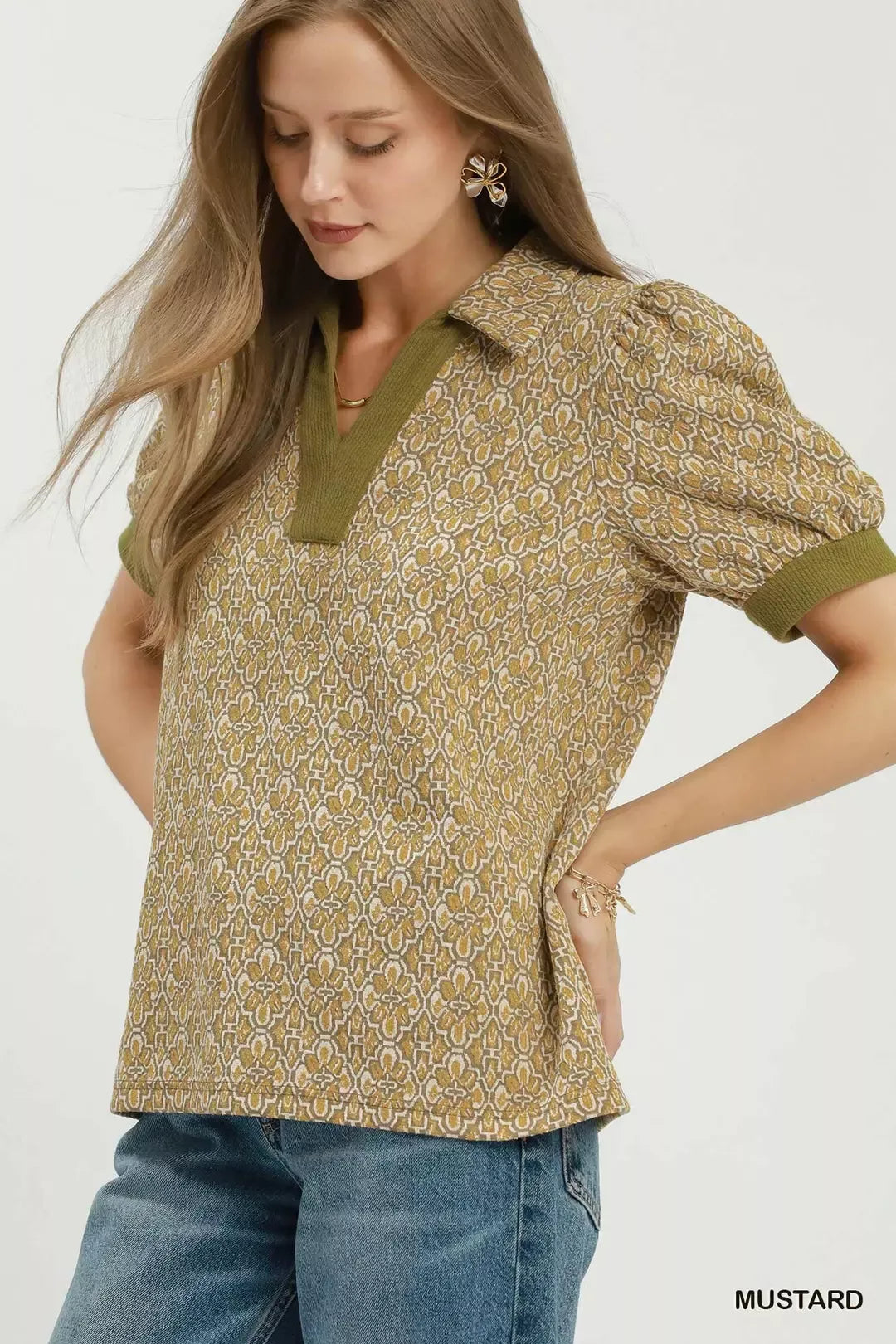 Front view of the mustard printed top on a model