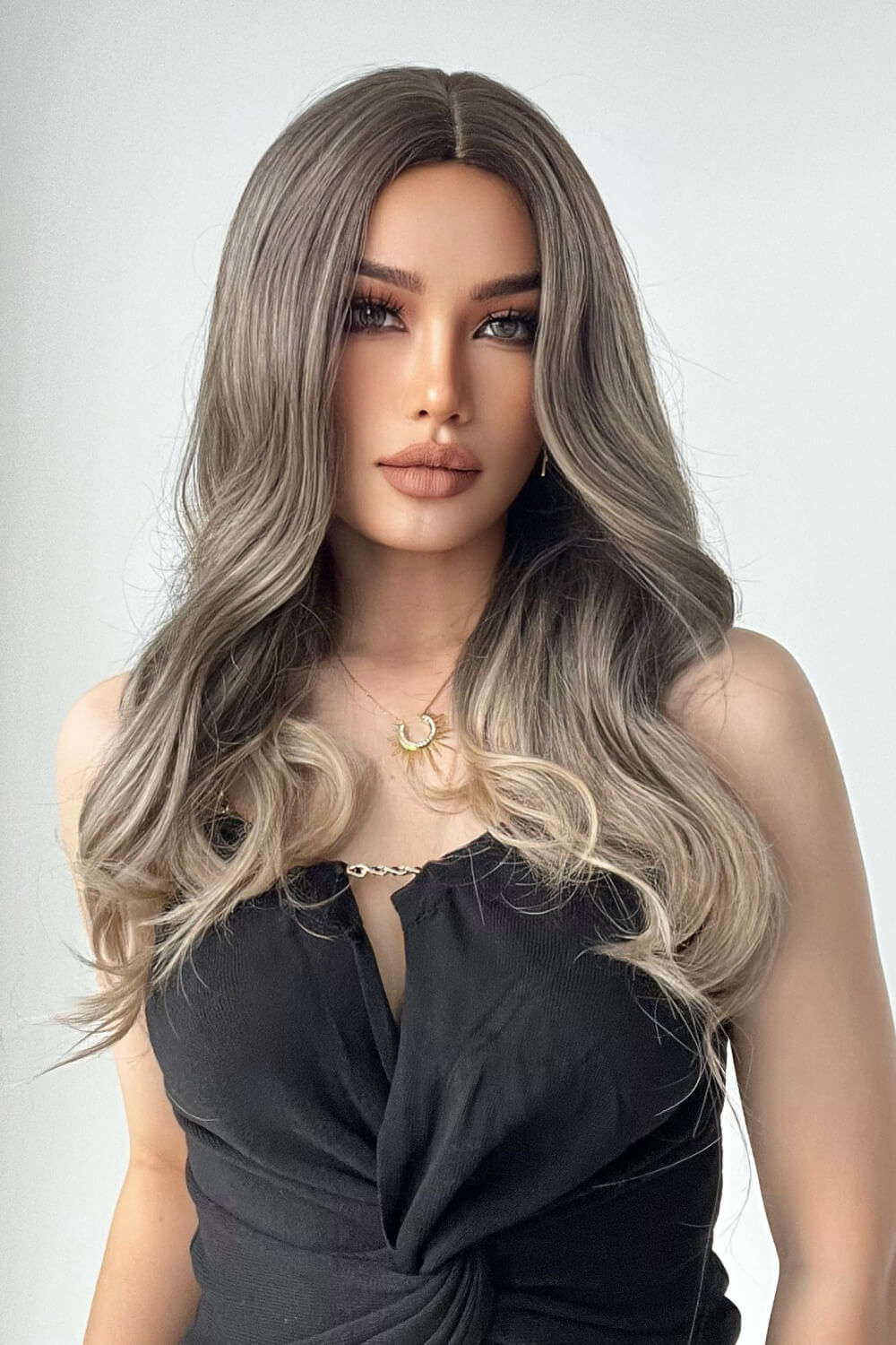 Angled view of ash brown blonde straight wig