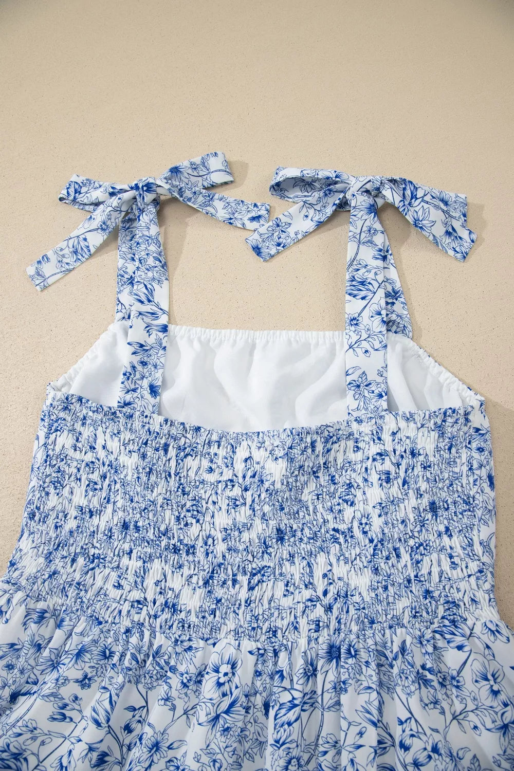 Light blue floral knot strap high waist flared maxi dress front view