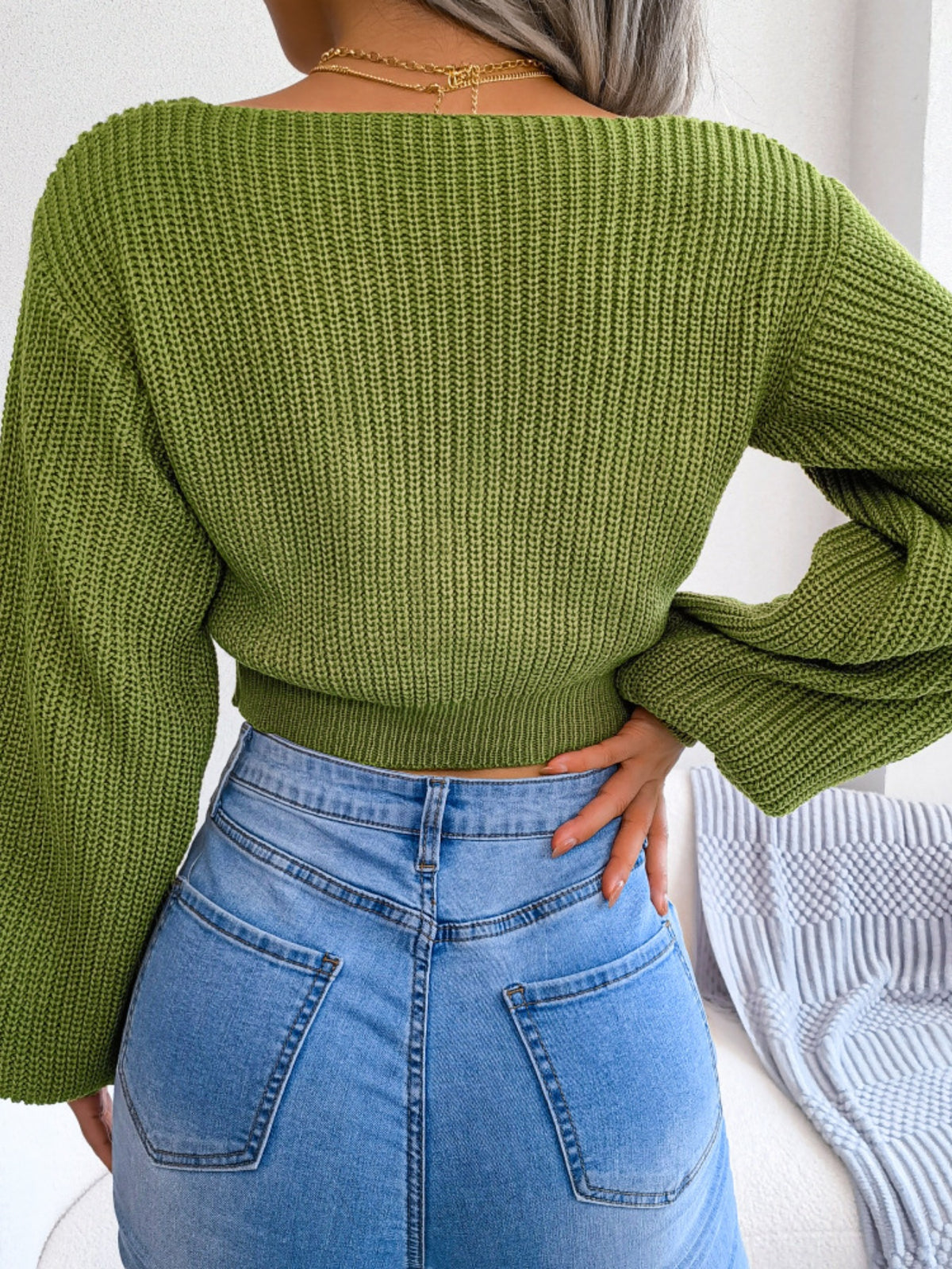 Cropped sweater tie knot detail