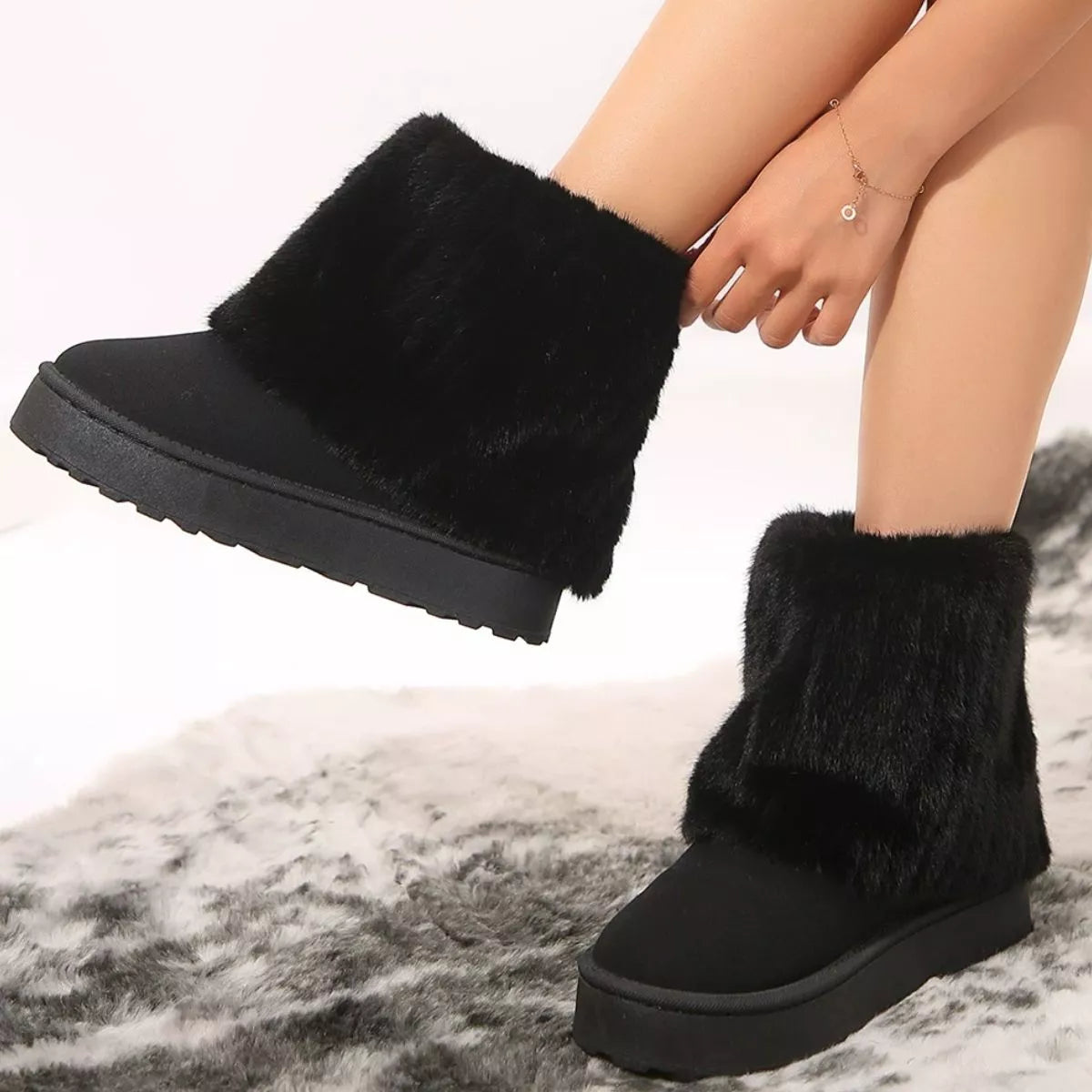 Fuzzy round toe platform boots styled with jeans