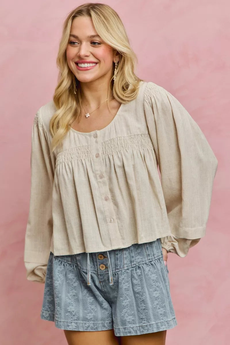 Cream linen blend smocked long sleeve top, side view