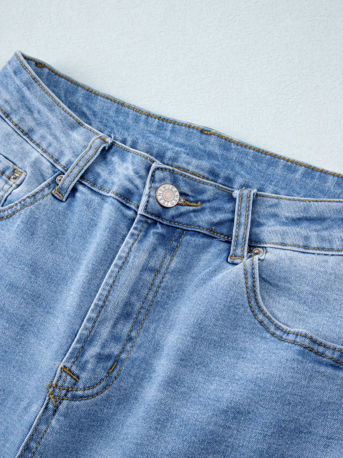 Angled pose in wide leg jeans