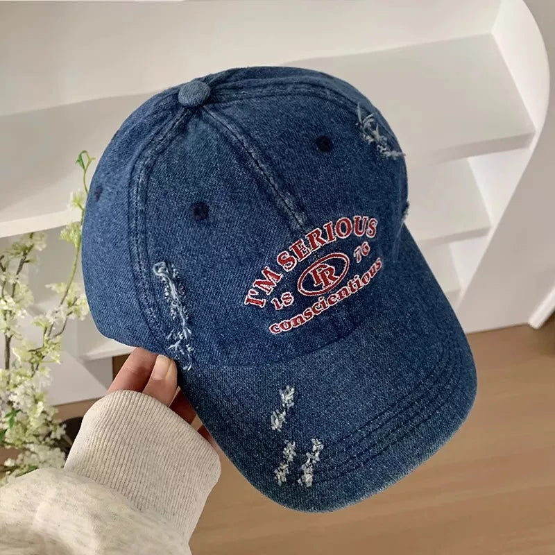 Distressed cap shown in the light blue colorway