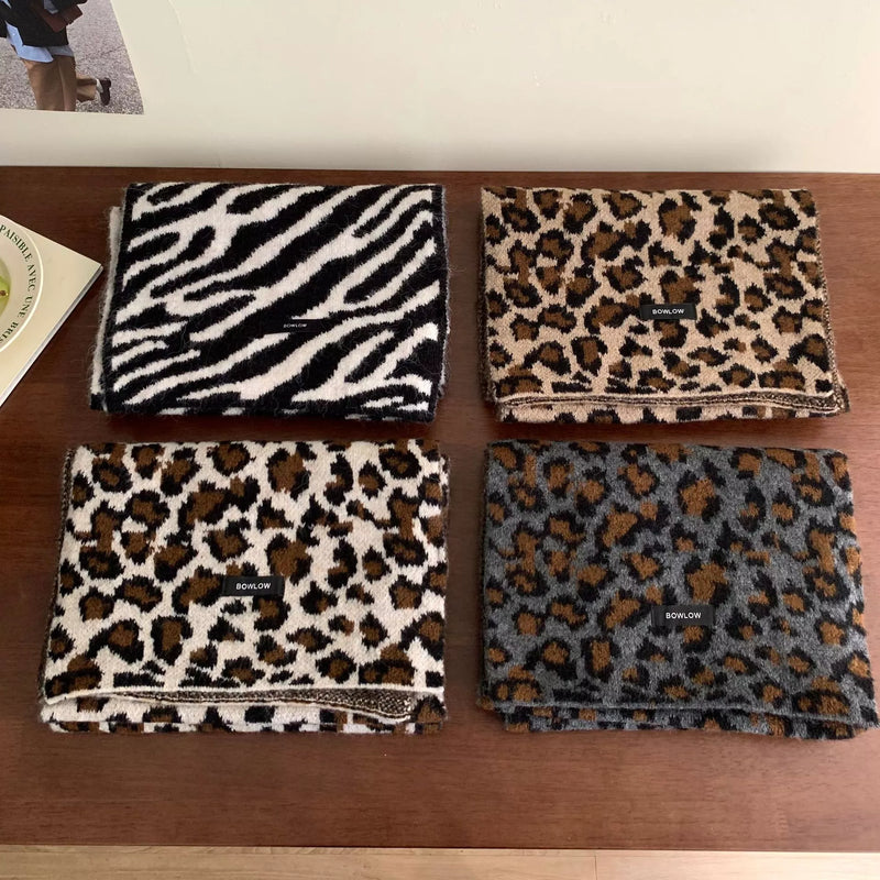 Animal print plush winter scarf shown around the neck