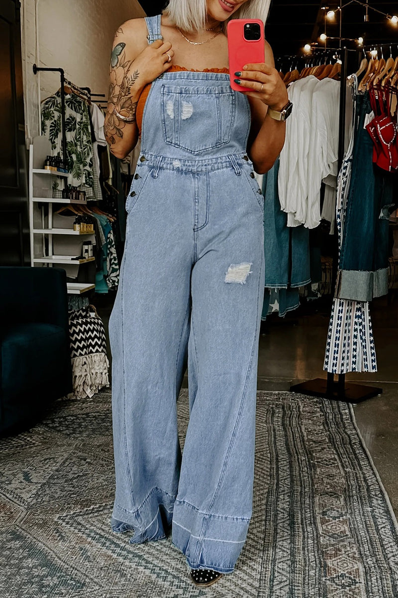 Distressed wide leg denim overalls front view
