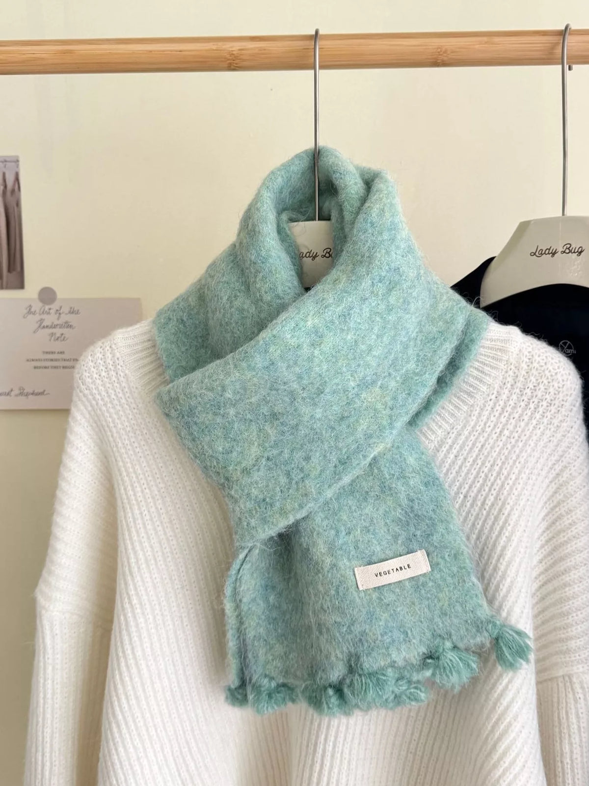 Wool tassel scarf knotted at the neck
