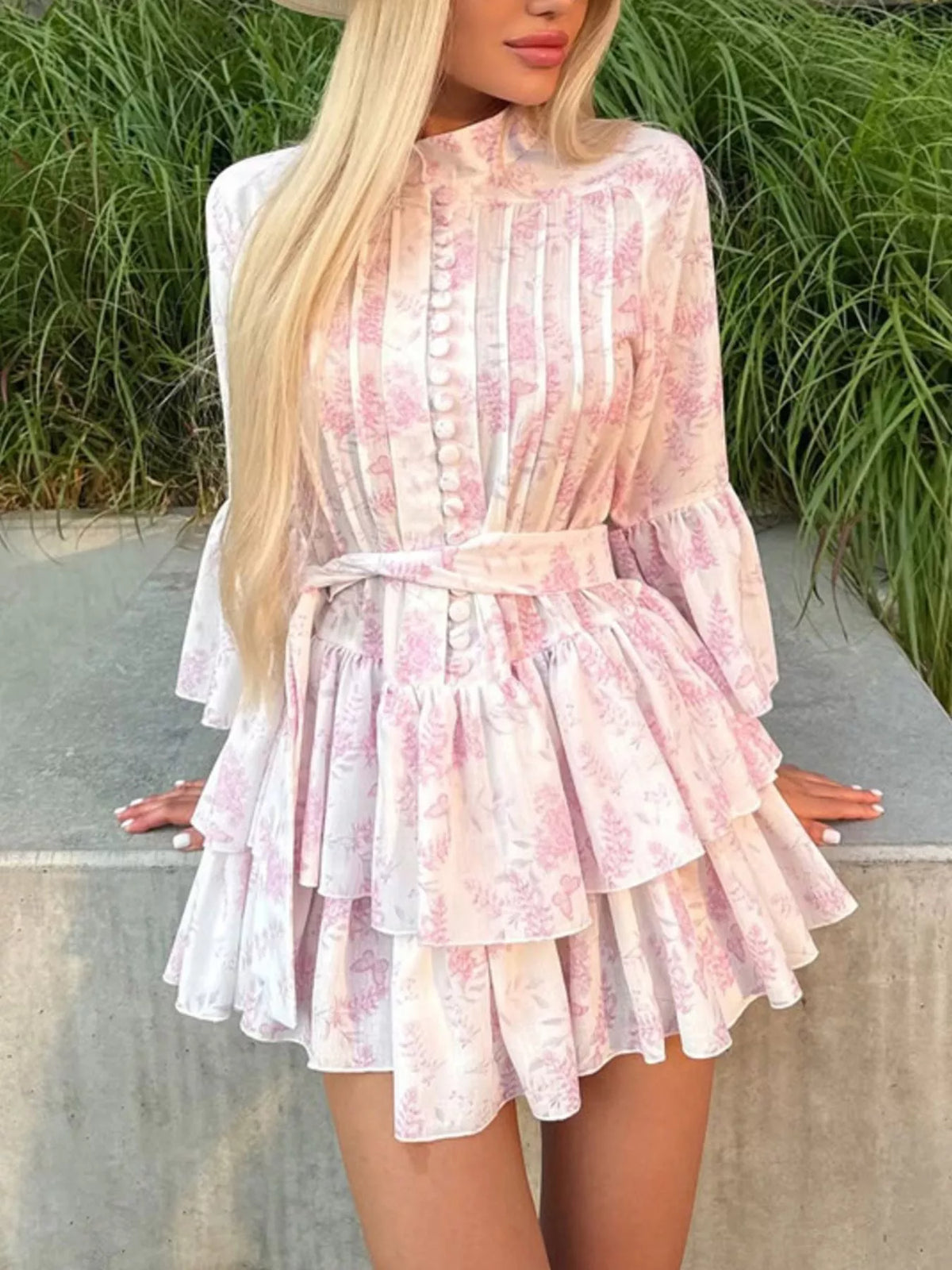 Front view of the floral ruffle dress on a model