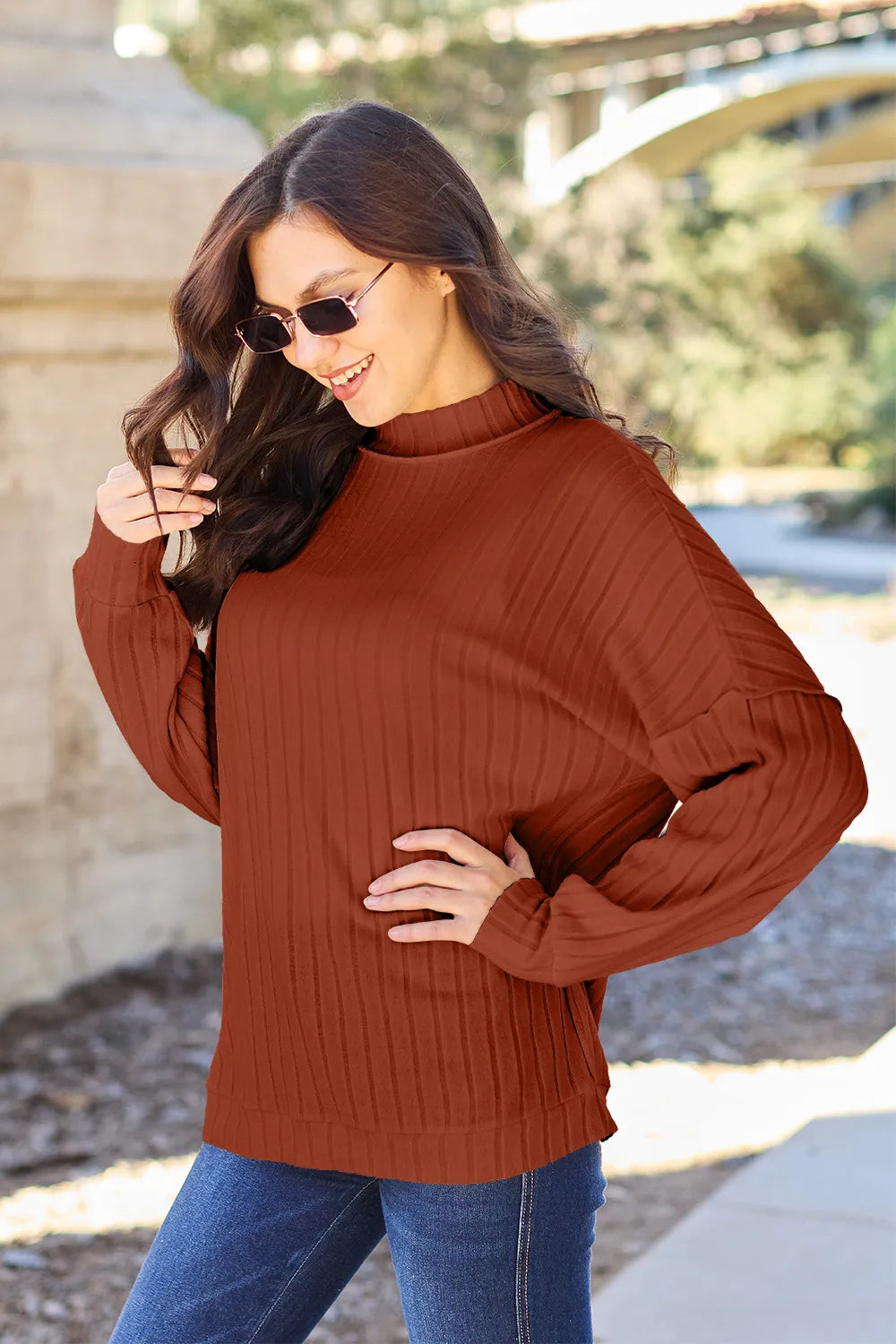 Close up of exposed seam detail on ribbed top