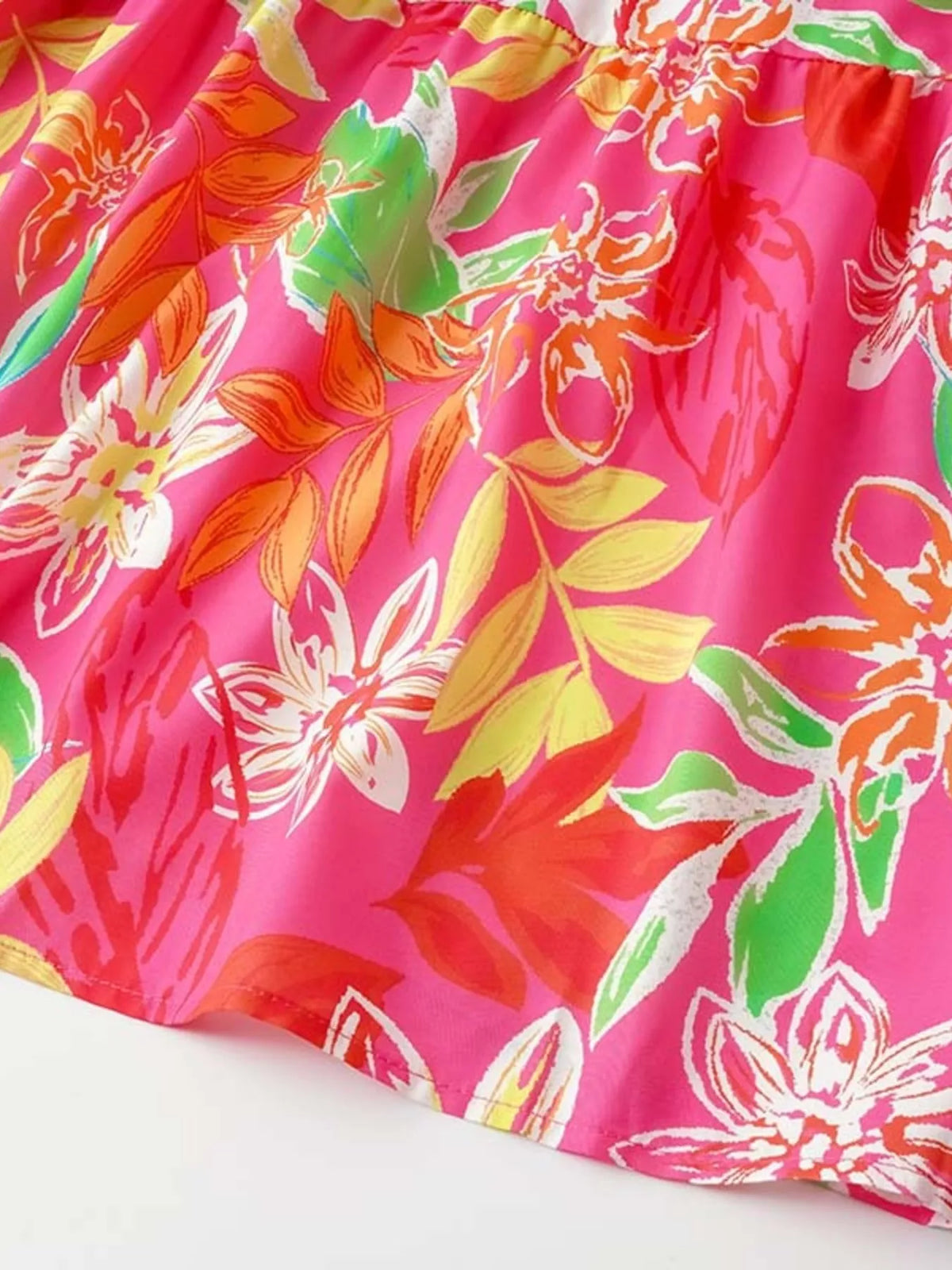 Tropical print smocked tie strap dress side view