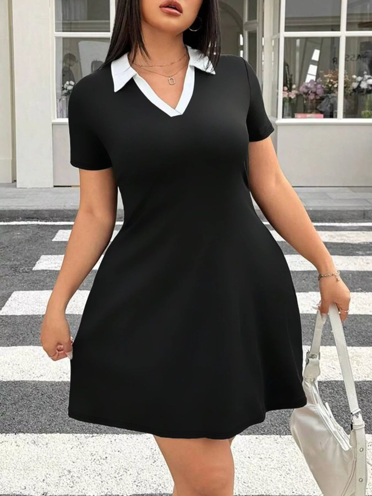 Plus size black bodycon mini dress side view