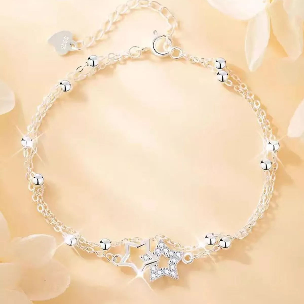 Zircon star bracelet shown against a light surface