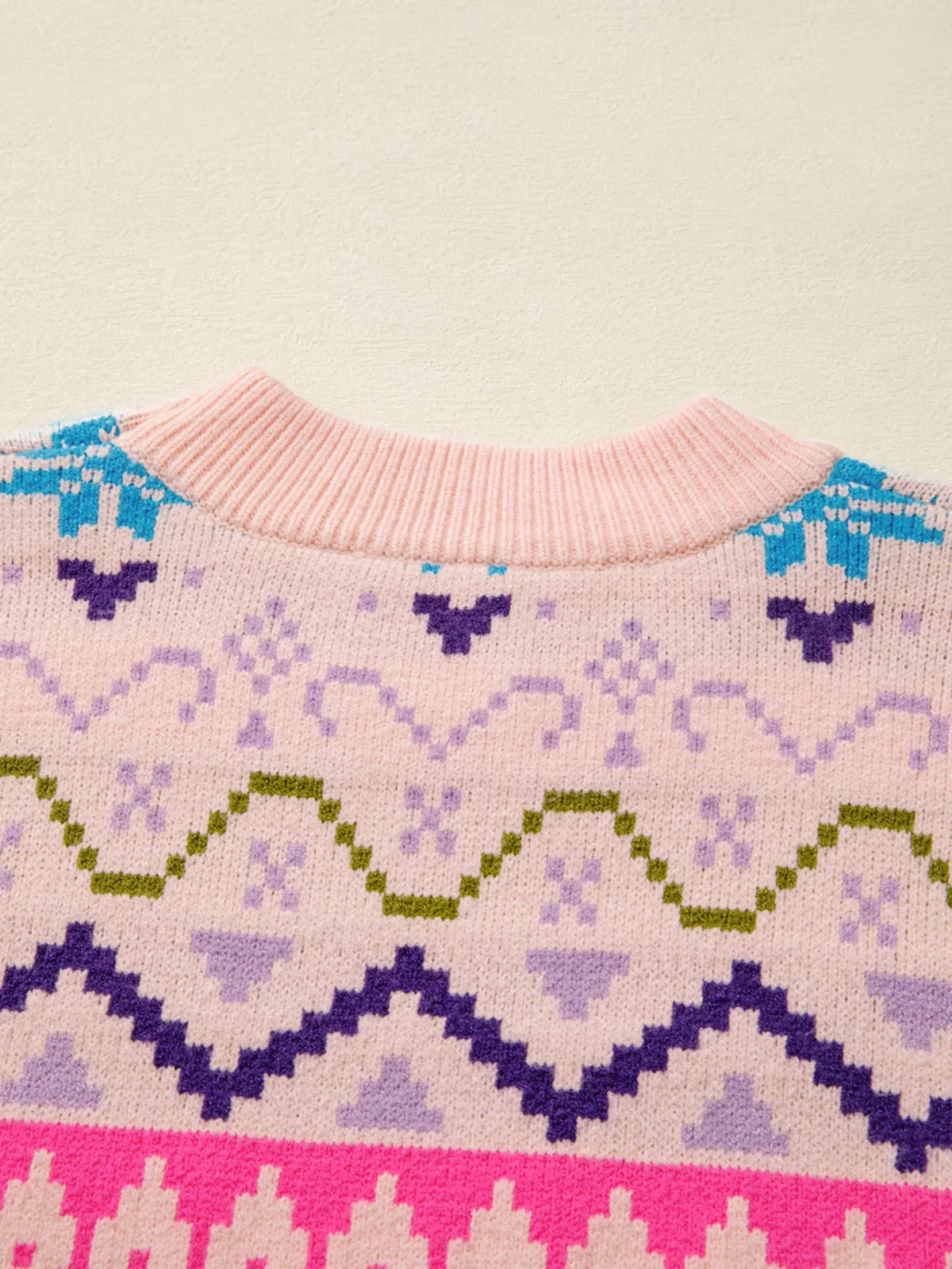 blush pink feather cuff patterned knit sweater knit texture close up