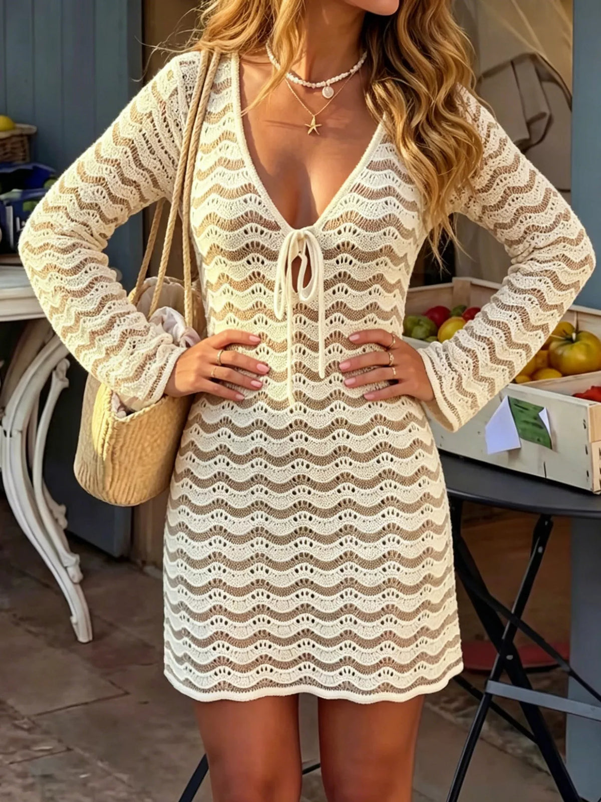 Front view of the crochet mini dress showing the openwork knit