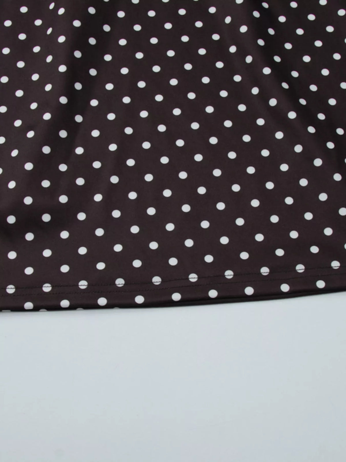 Sleeve and shoulder detail on polka dot mini dress