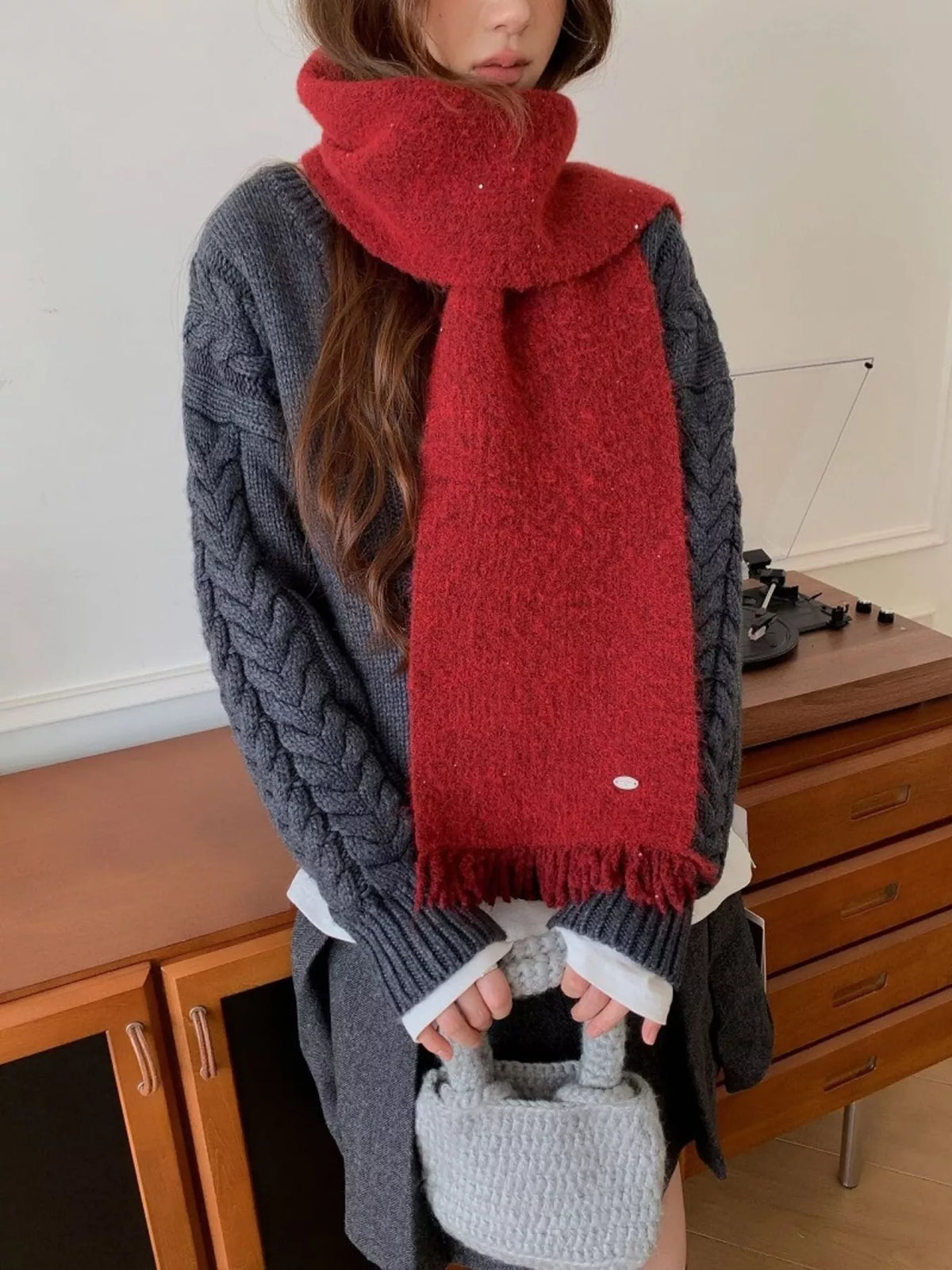 Fringe hem scarf shown in a cool blue shade
