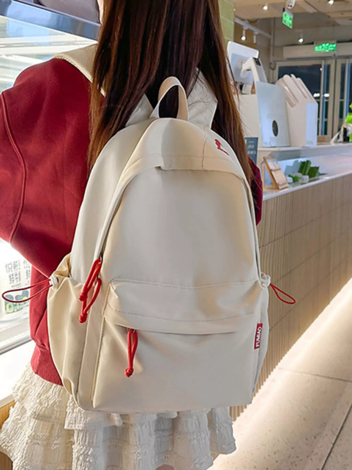 White casual nylon backpack zip and hardware detail