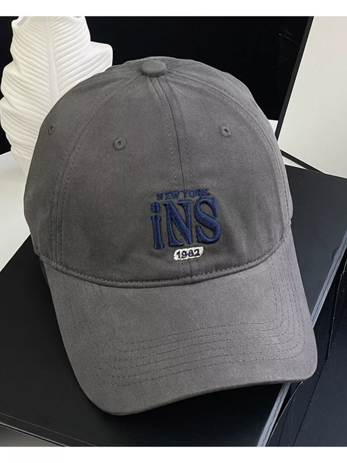 Embroidered baseball cap shown in navy blue