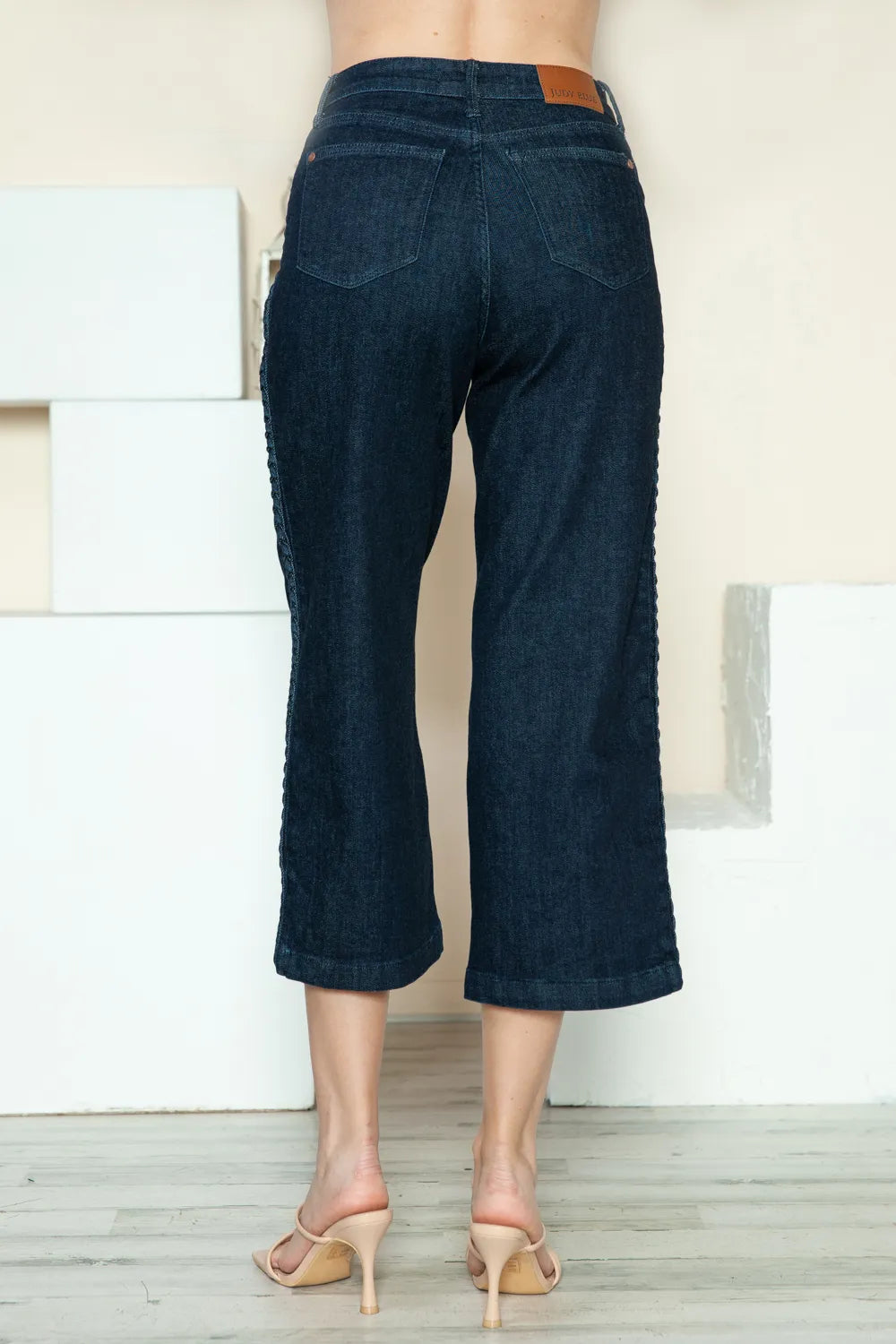 Back view of dark wash crop wide leg jeans