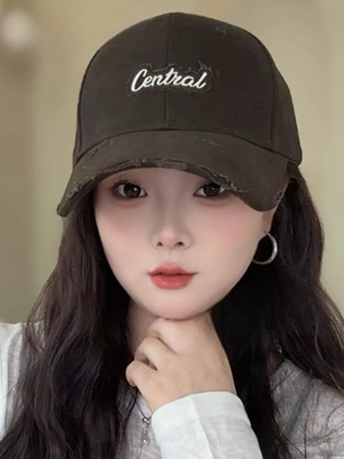 Distressed cap shown in a warm colorway