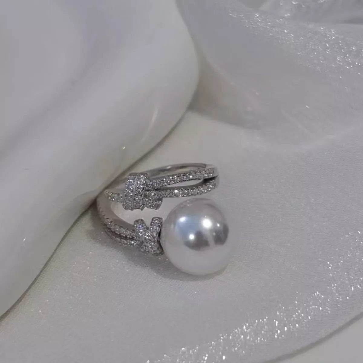 pearl and zircon bypass ring in sterling silver worn front