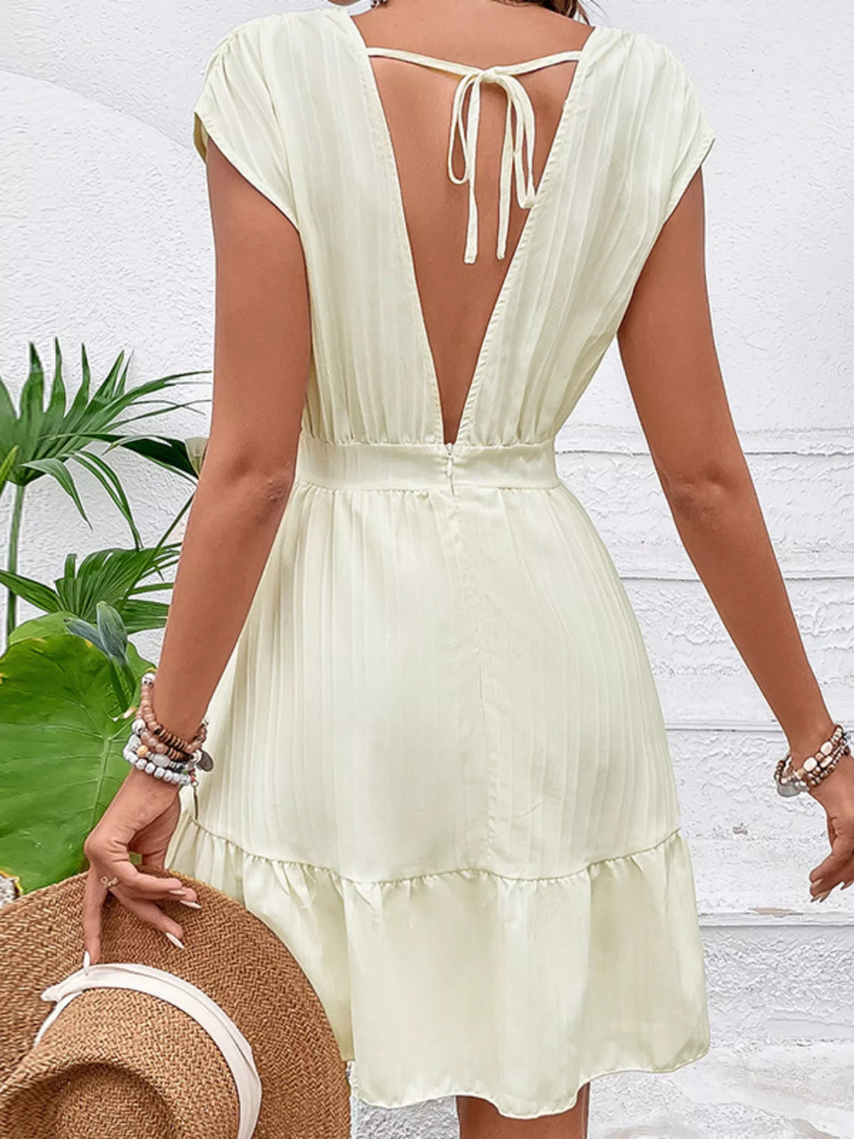 Detail of tiered skirt seams on short summer dress