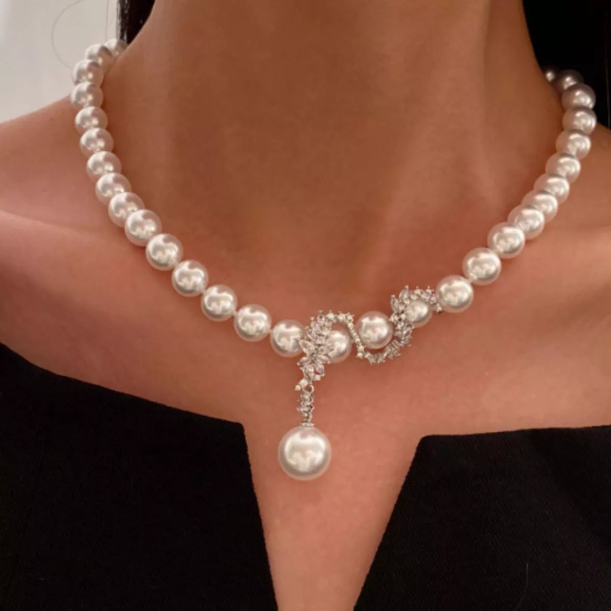 White pearl and zircon necklace on model