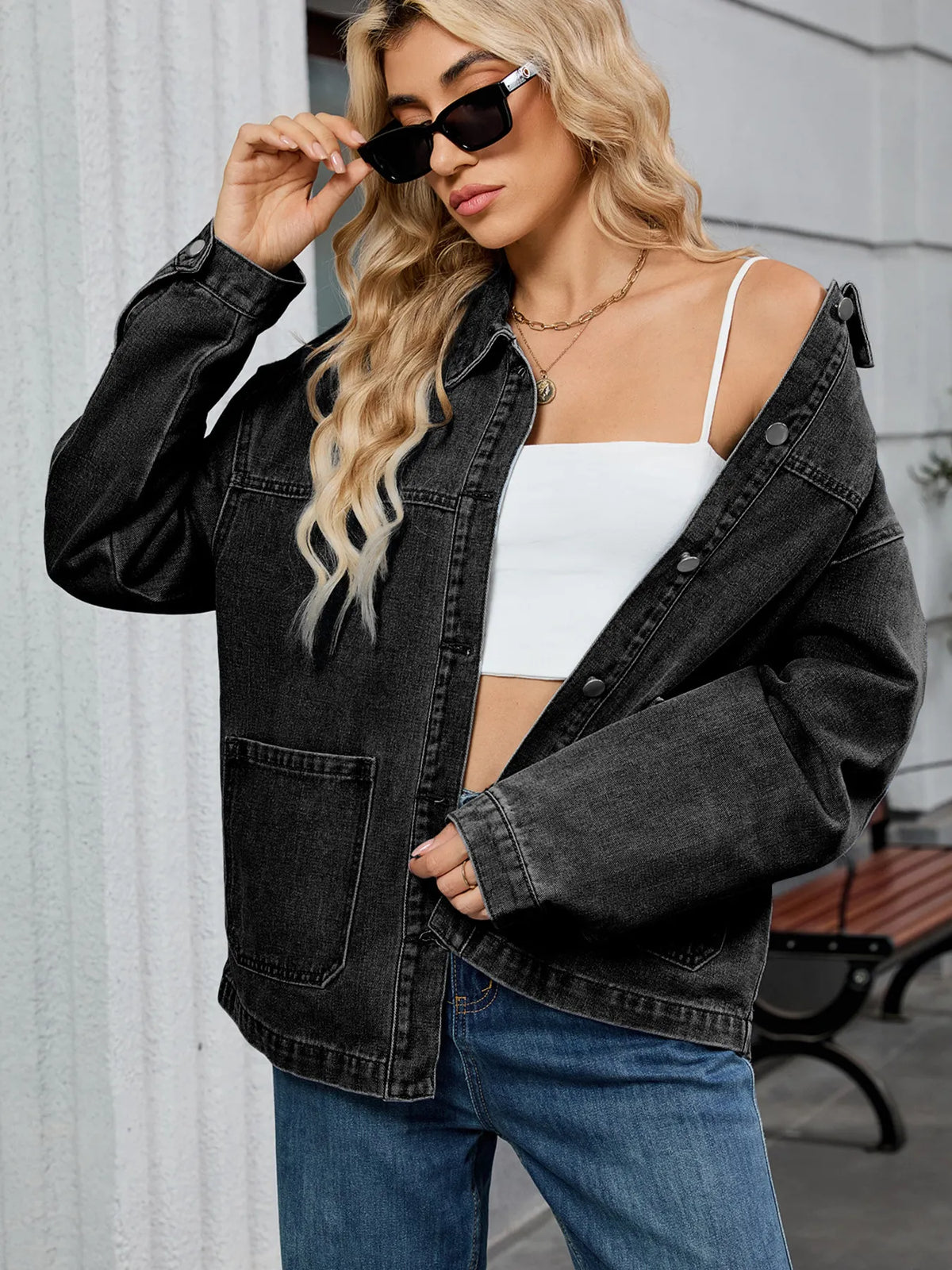 Denim jacket worn open over a tee