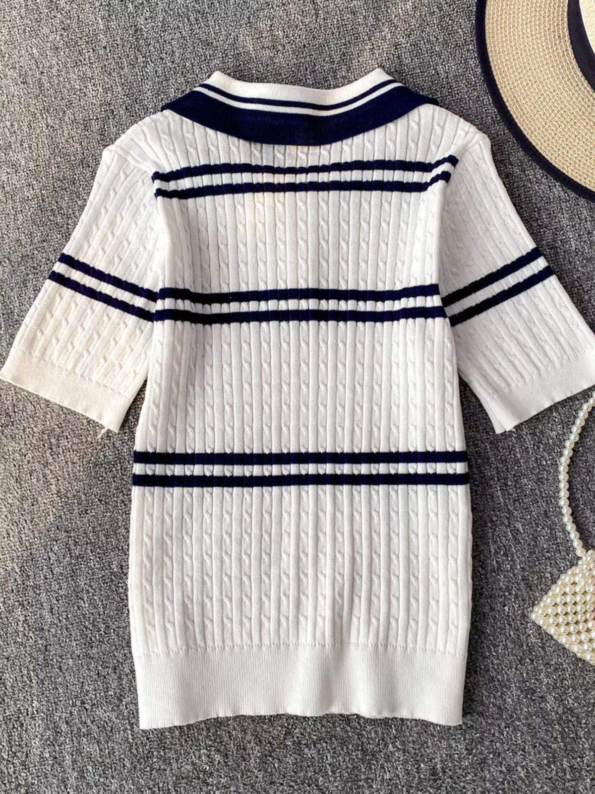Blue striped knit polo collar top front view