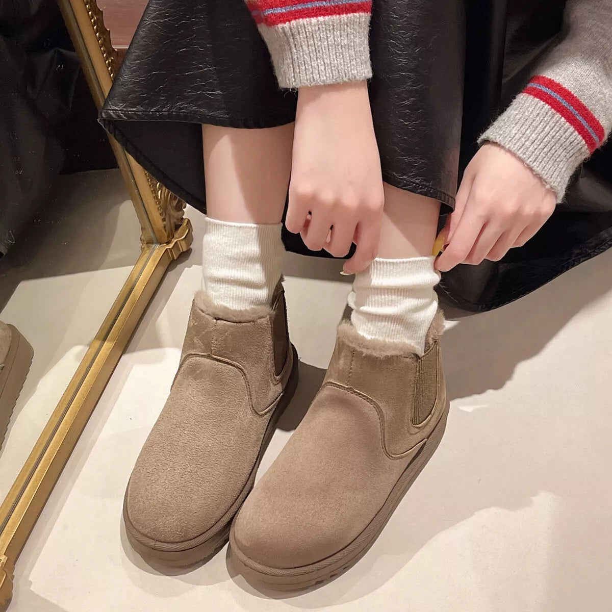 Round toe platform boots worn with cropped jeans