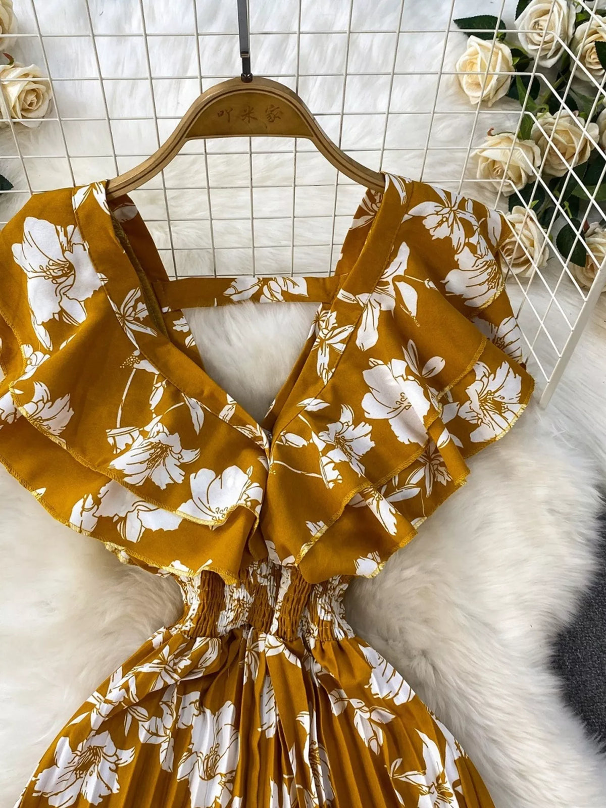 Floral print wide leg pleated jumpsuit close up view
