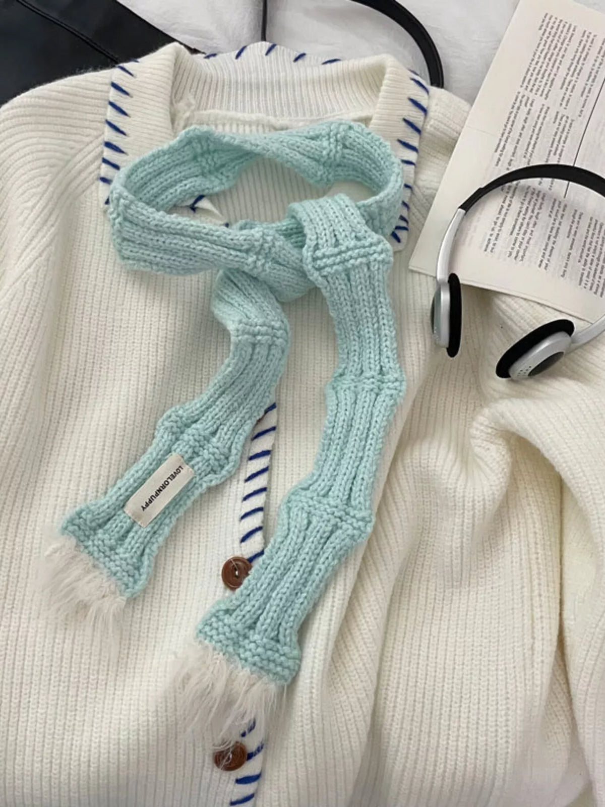 Knitted scarf draped detail