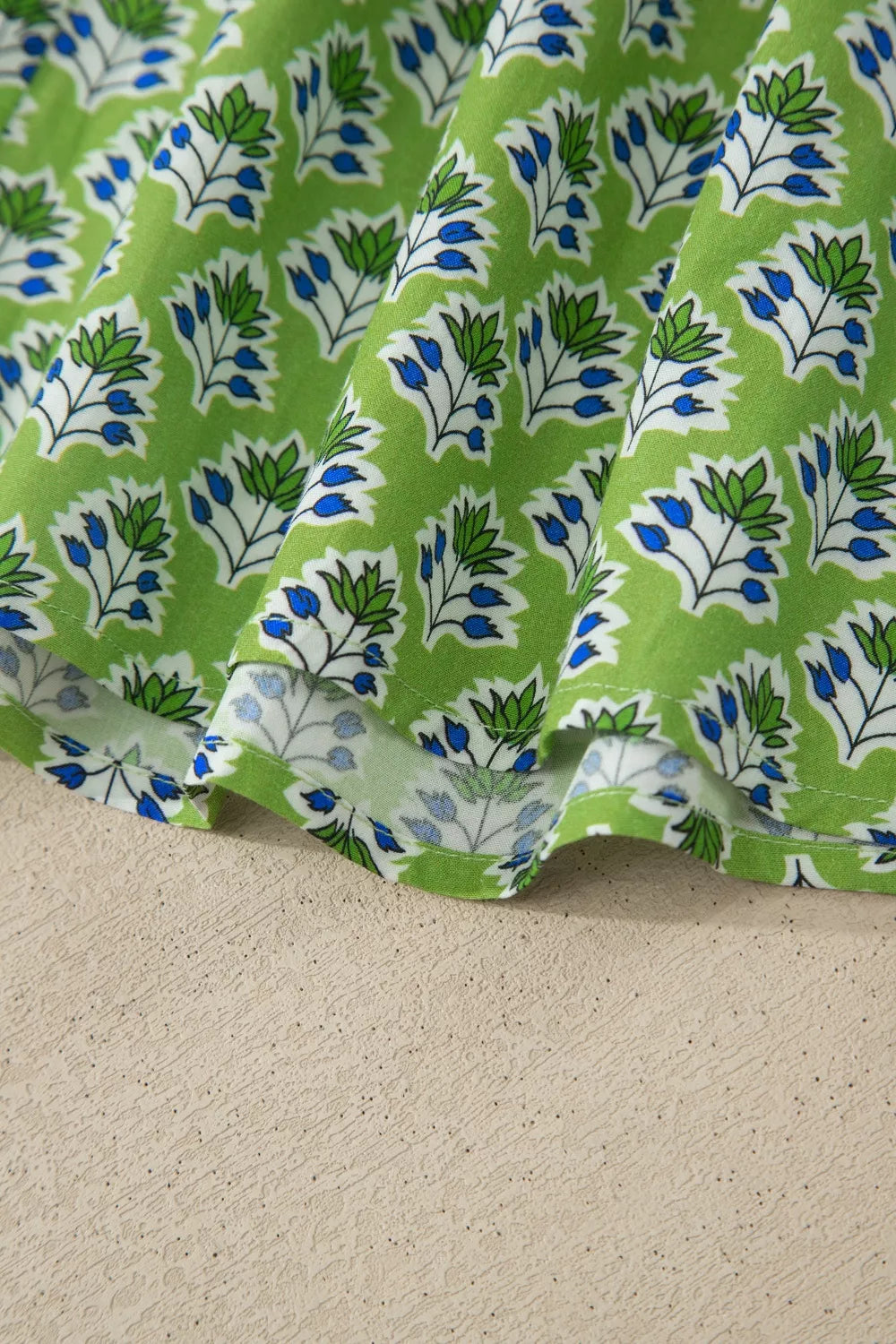 Matcha green floral print tie strap tank detail view