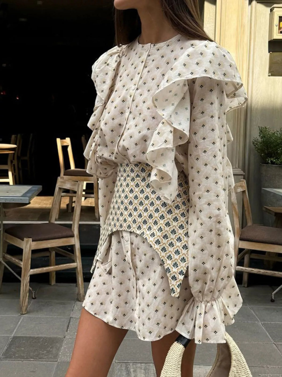 Floral mini dress shown with the belt tied at the waist