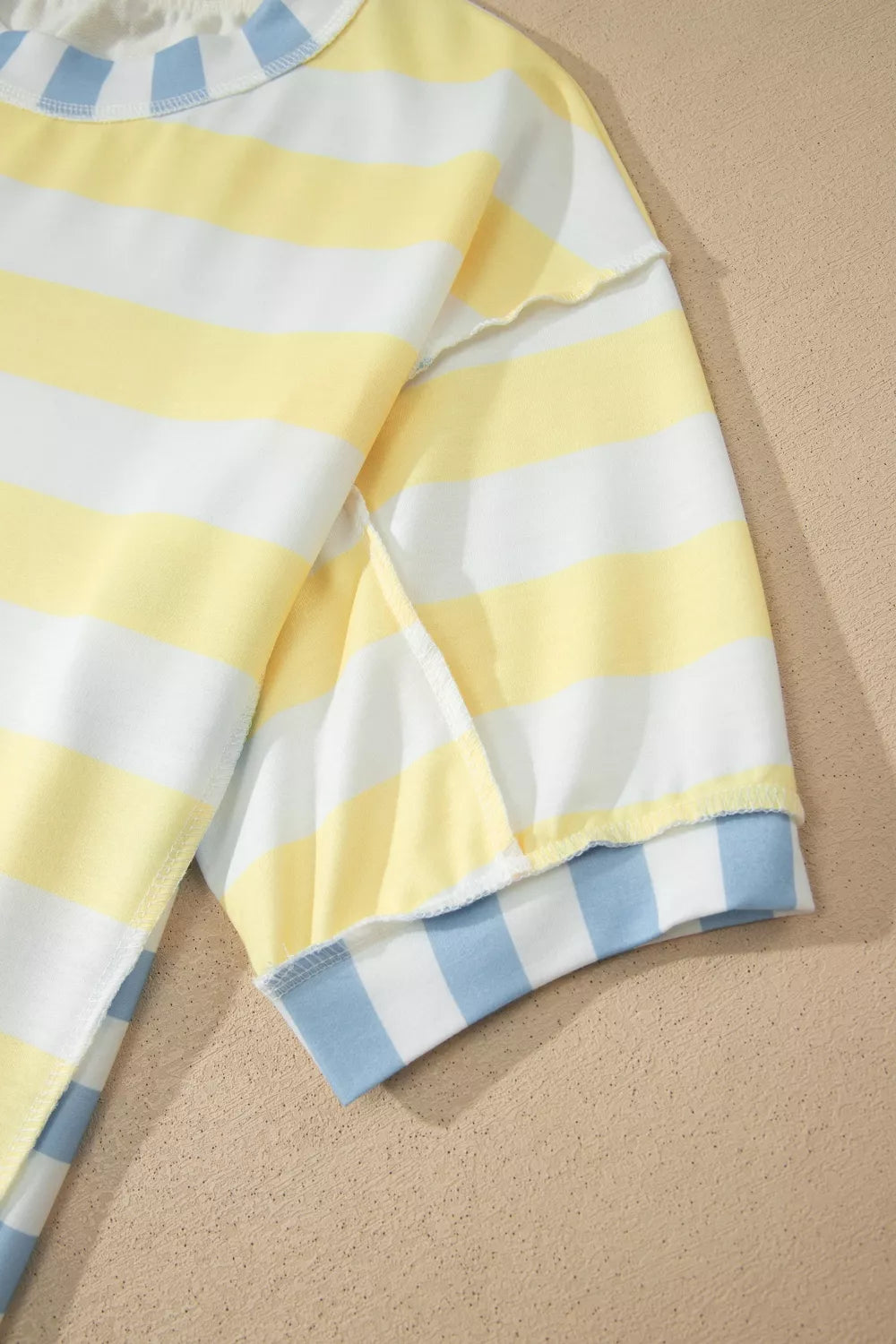 Casual striped top worn tucked at the front hem