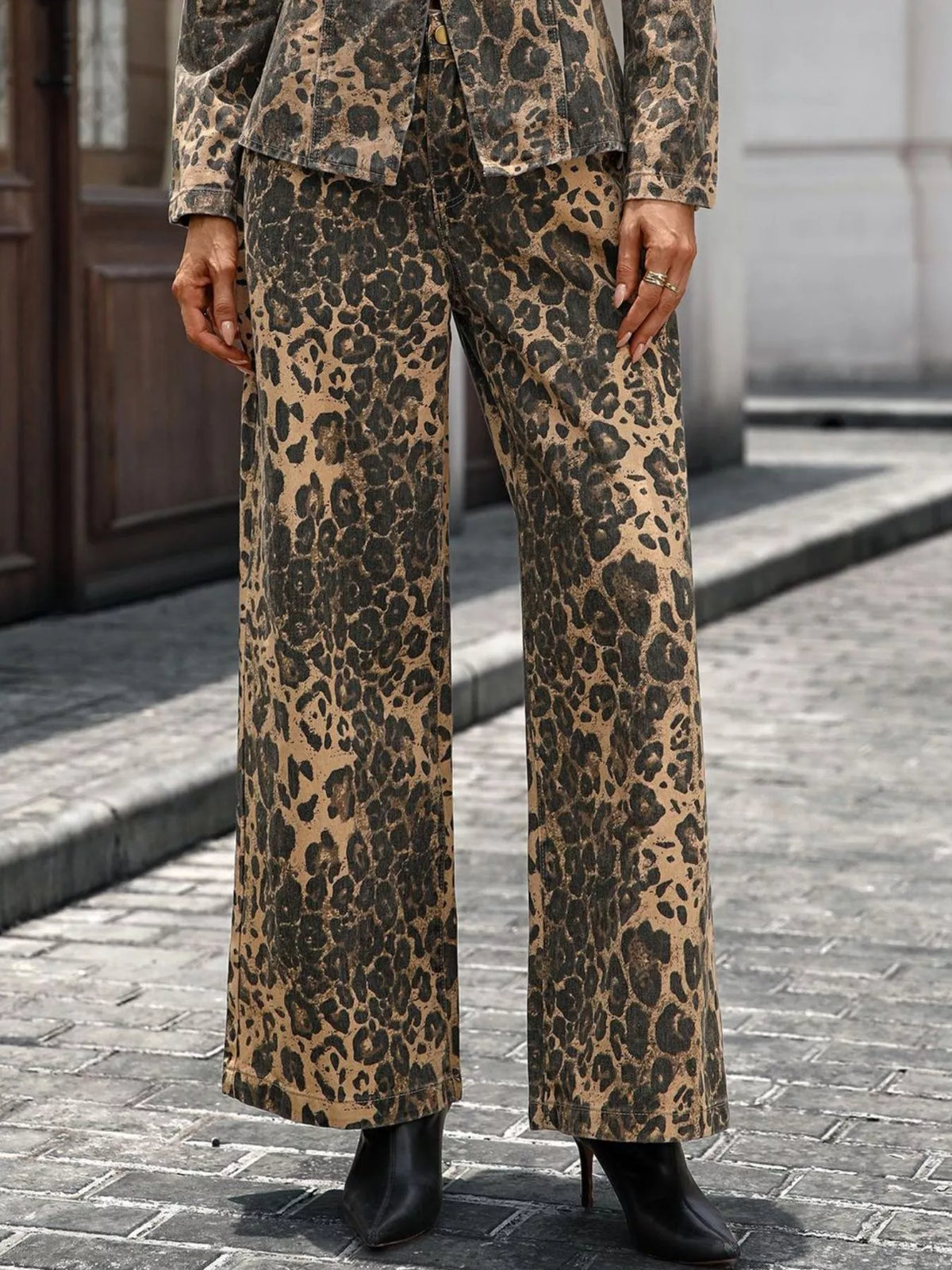 Leopard print wide leg jeans on model side view