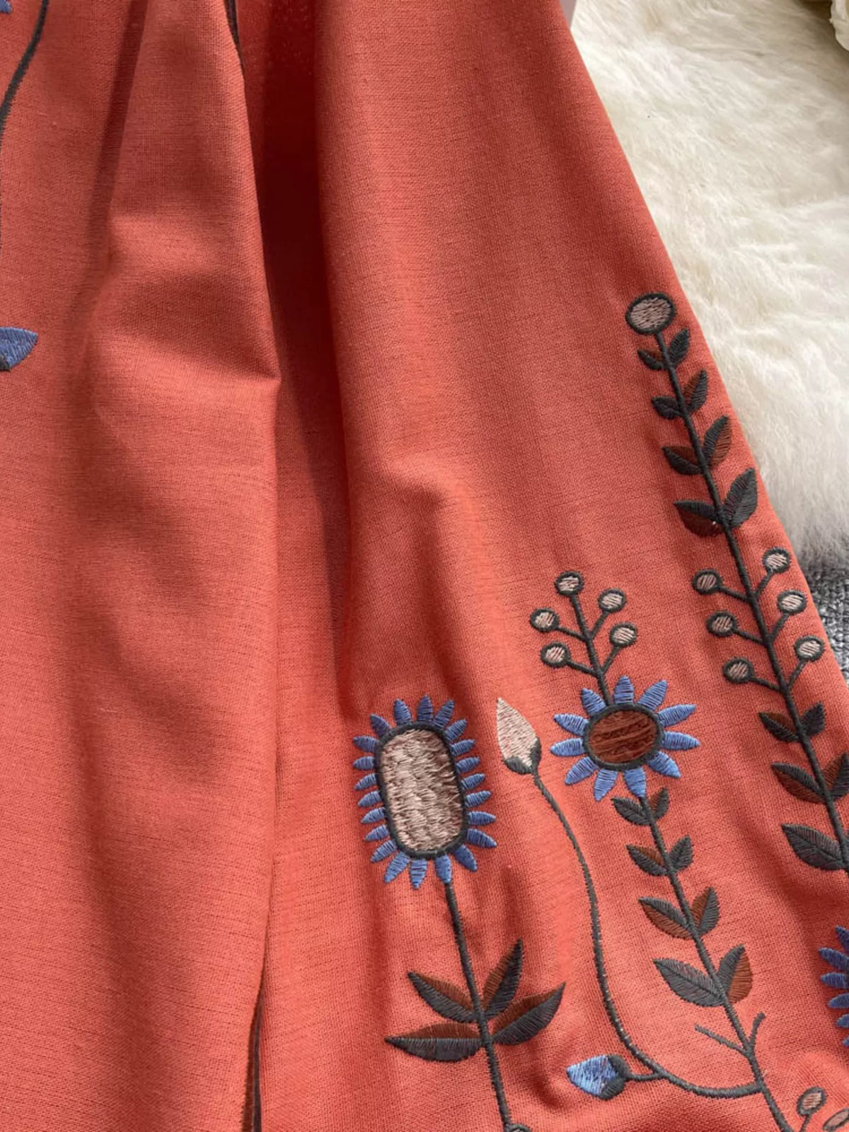 Short sleeve embroidered blouse shown from the back