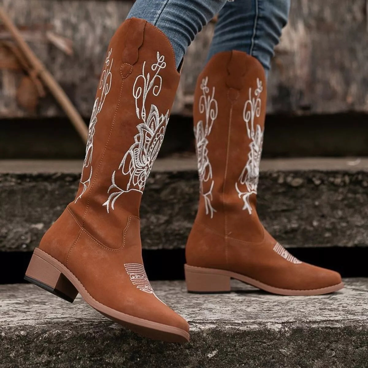 Embroidered western block heel boots styled on model