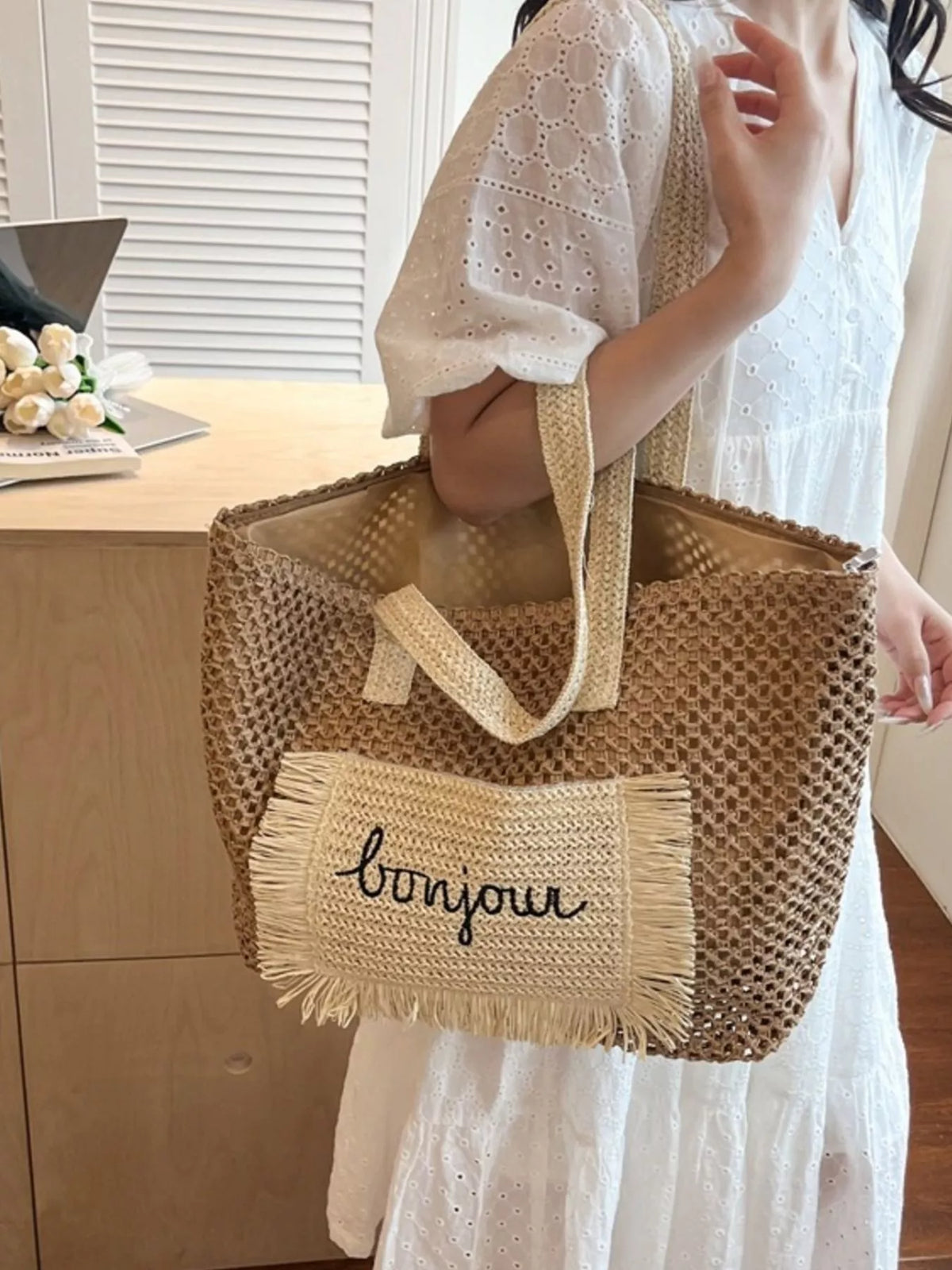 Woven straw bag styled with summer outfit