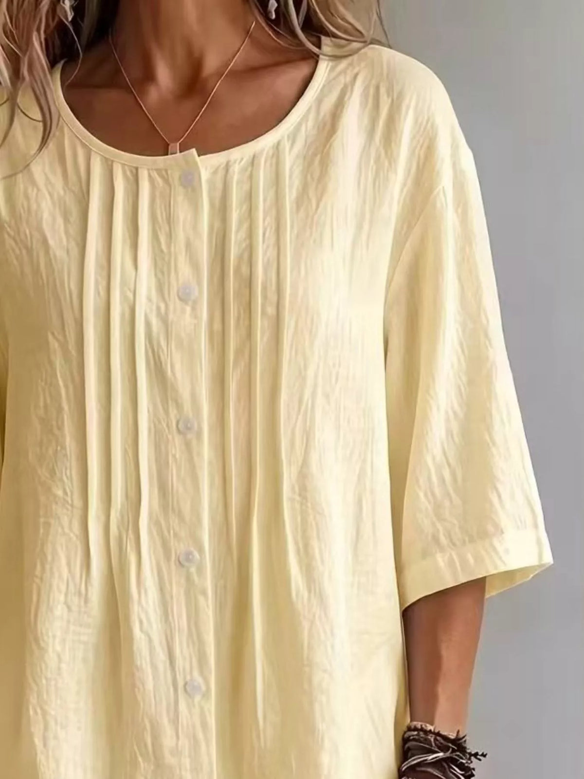 Round neck blouse fabric texture close up