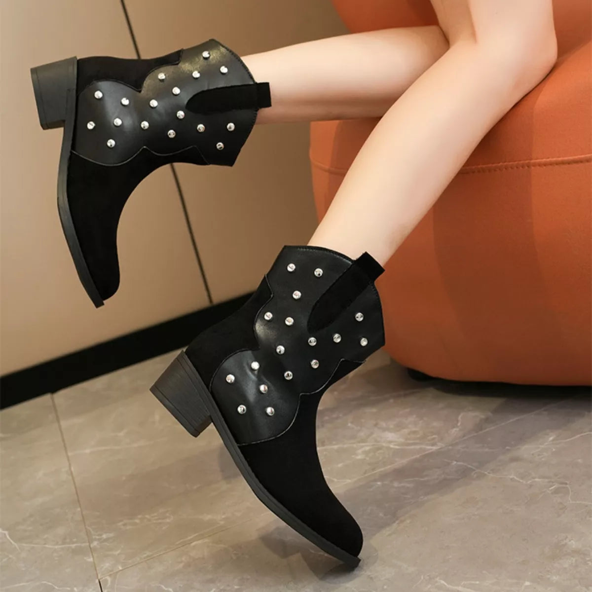 Studded western ankle boots styled with jeans