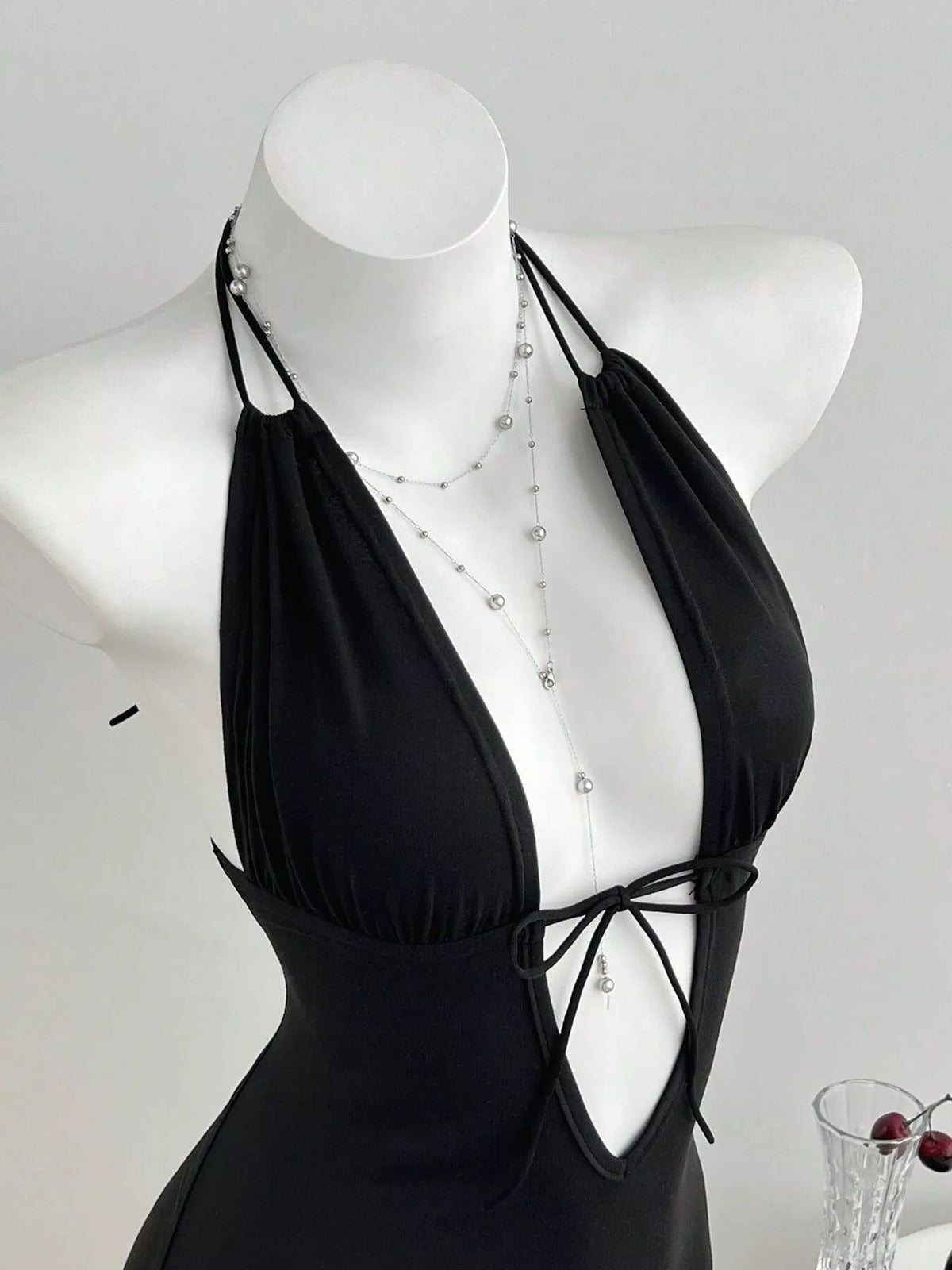 Black halter neck romper tie front detail