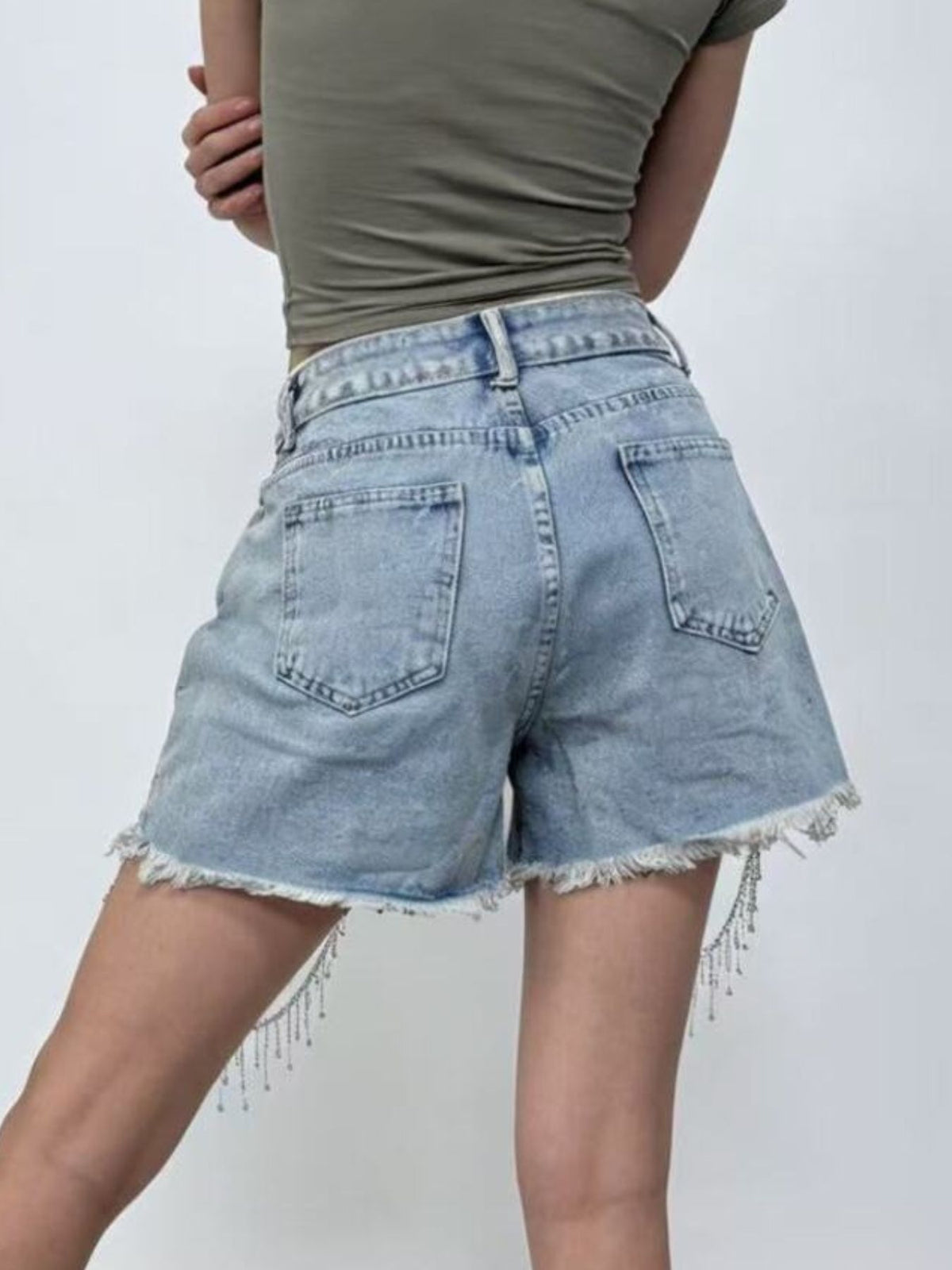 Rhinestone chain detail on denim shorts