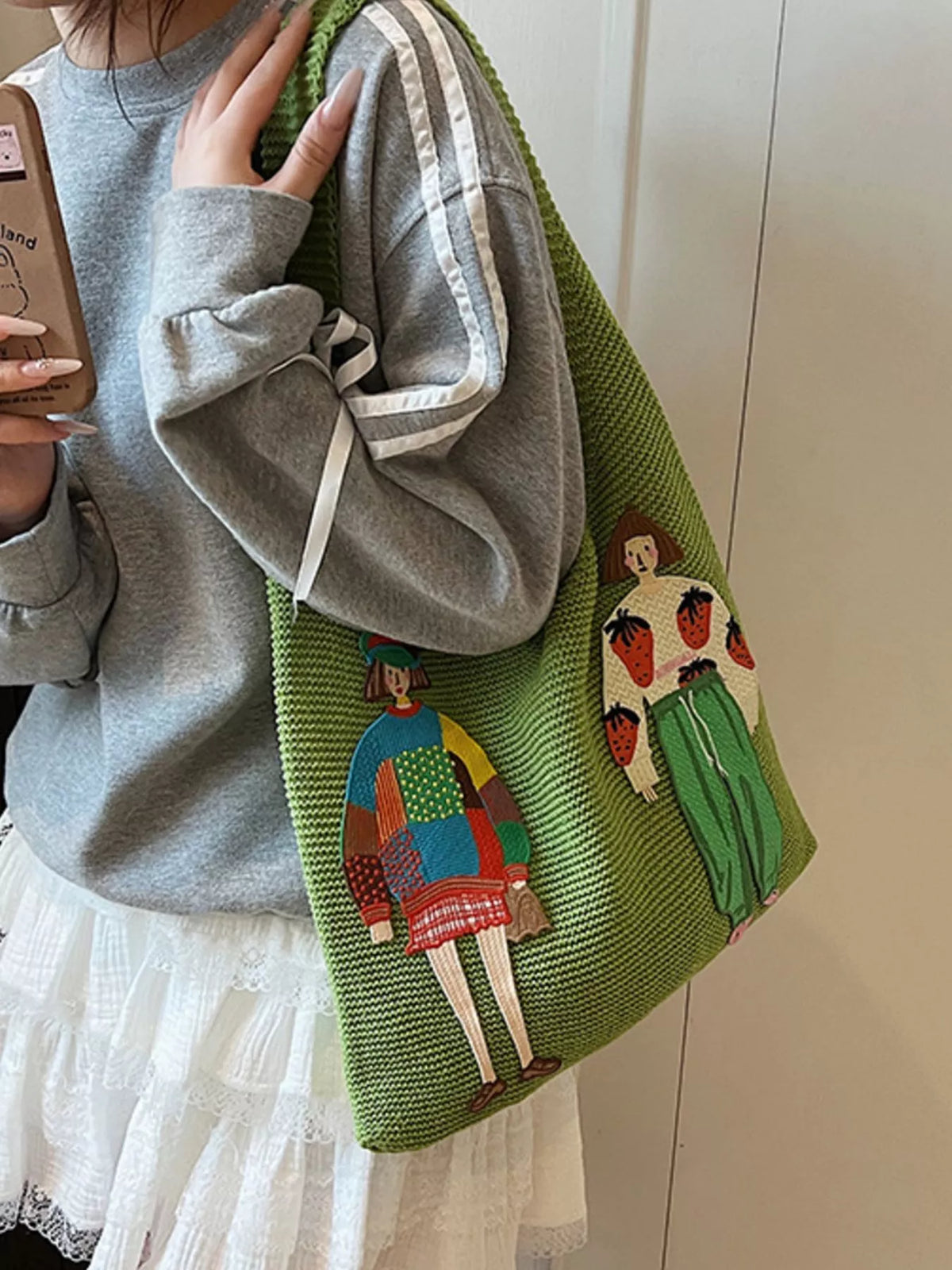Green knitted bag styled with boho outfit