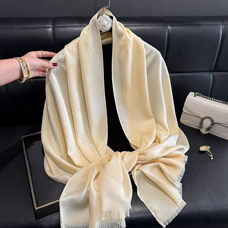 Lightweight raw hem scarf draped softly around the neck