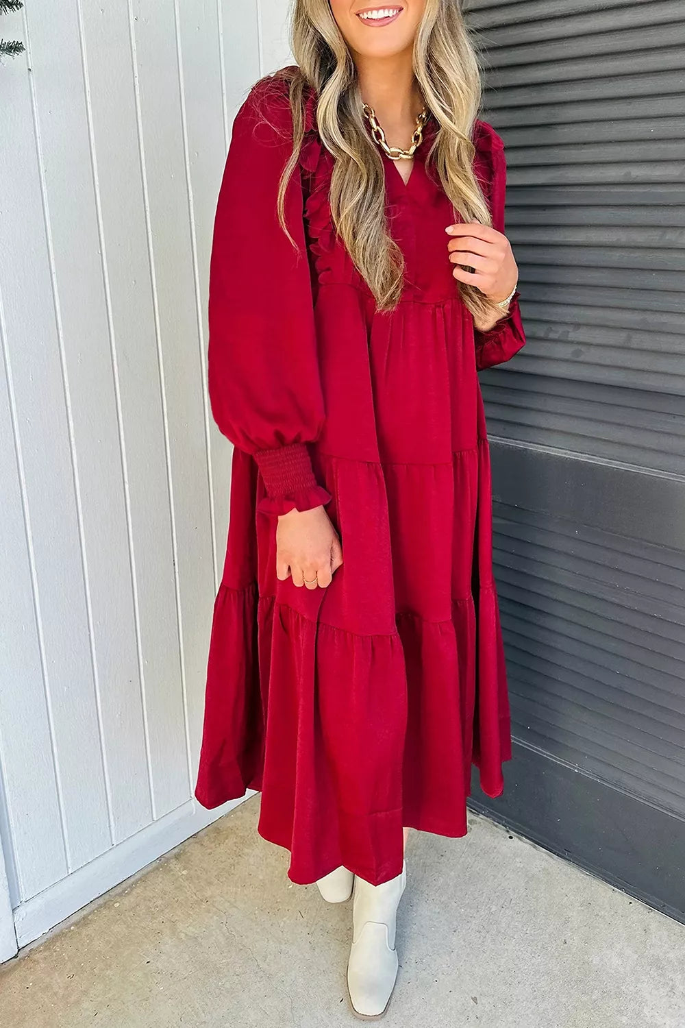 Model wearing burgundy tiered midi dress, full length
