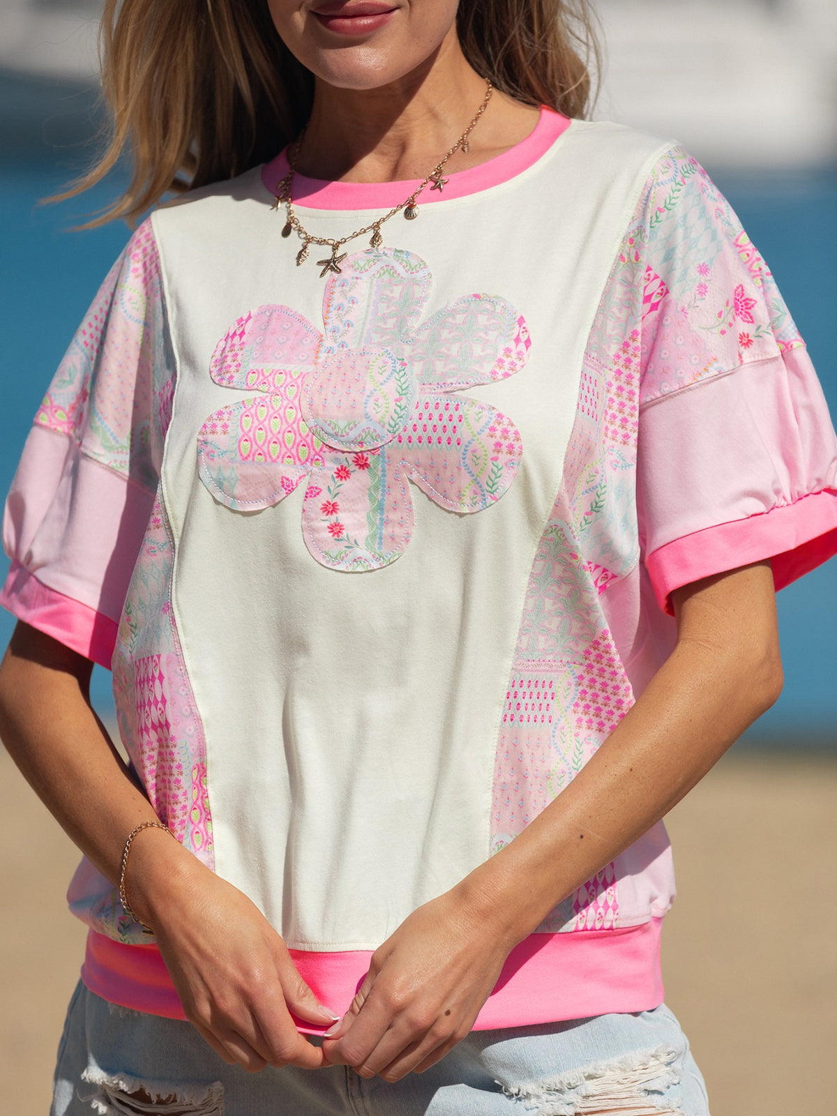 Short sleeve and shoulder view of the floral top