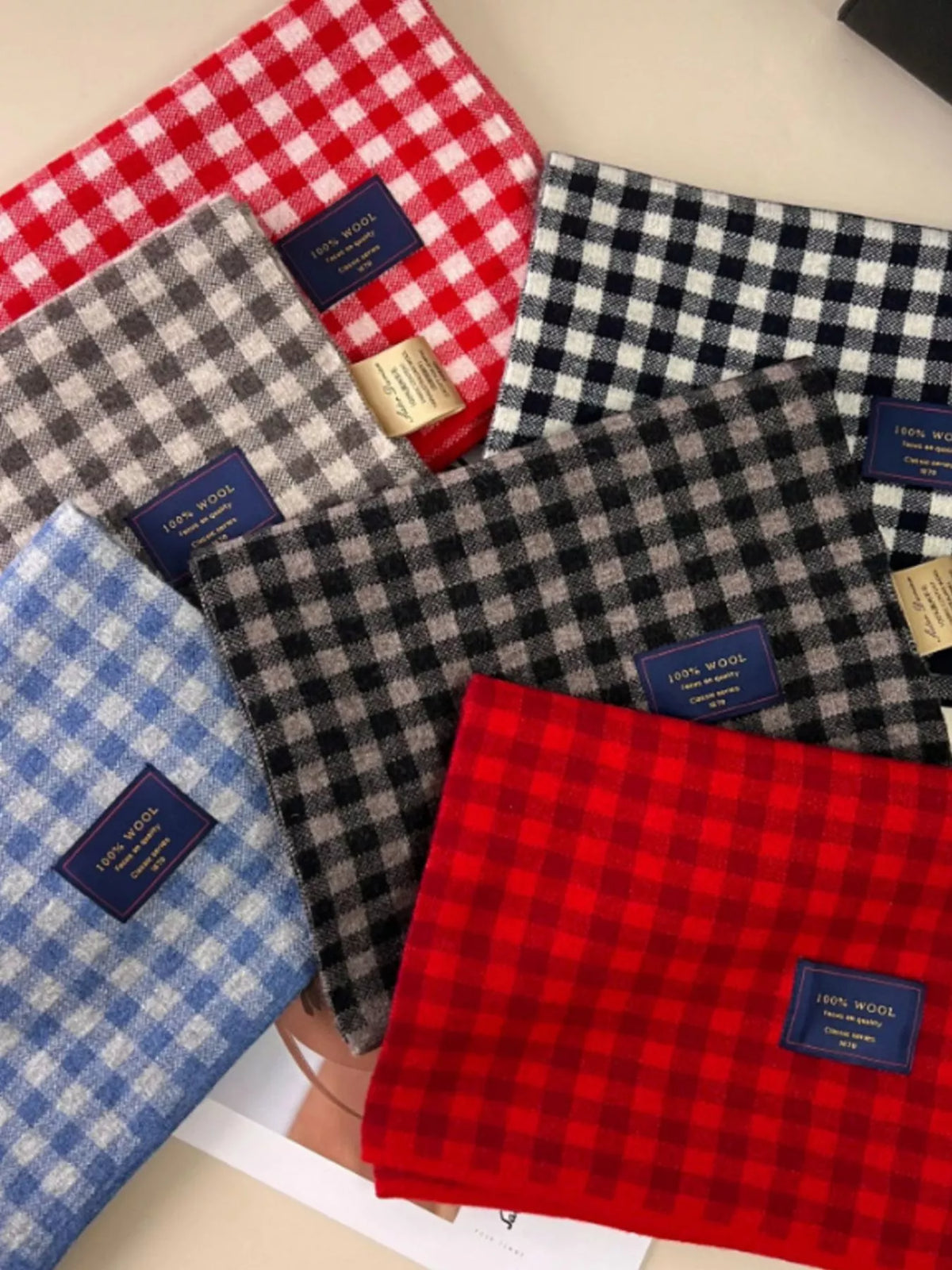 Close view of the plaid check on the wool scarf