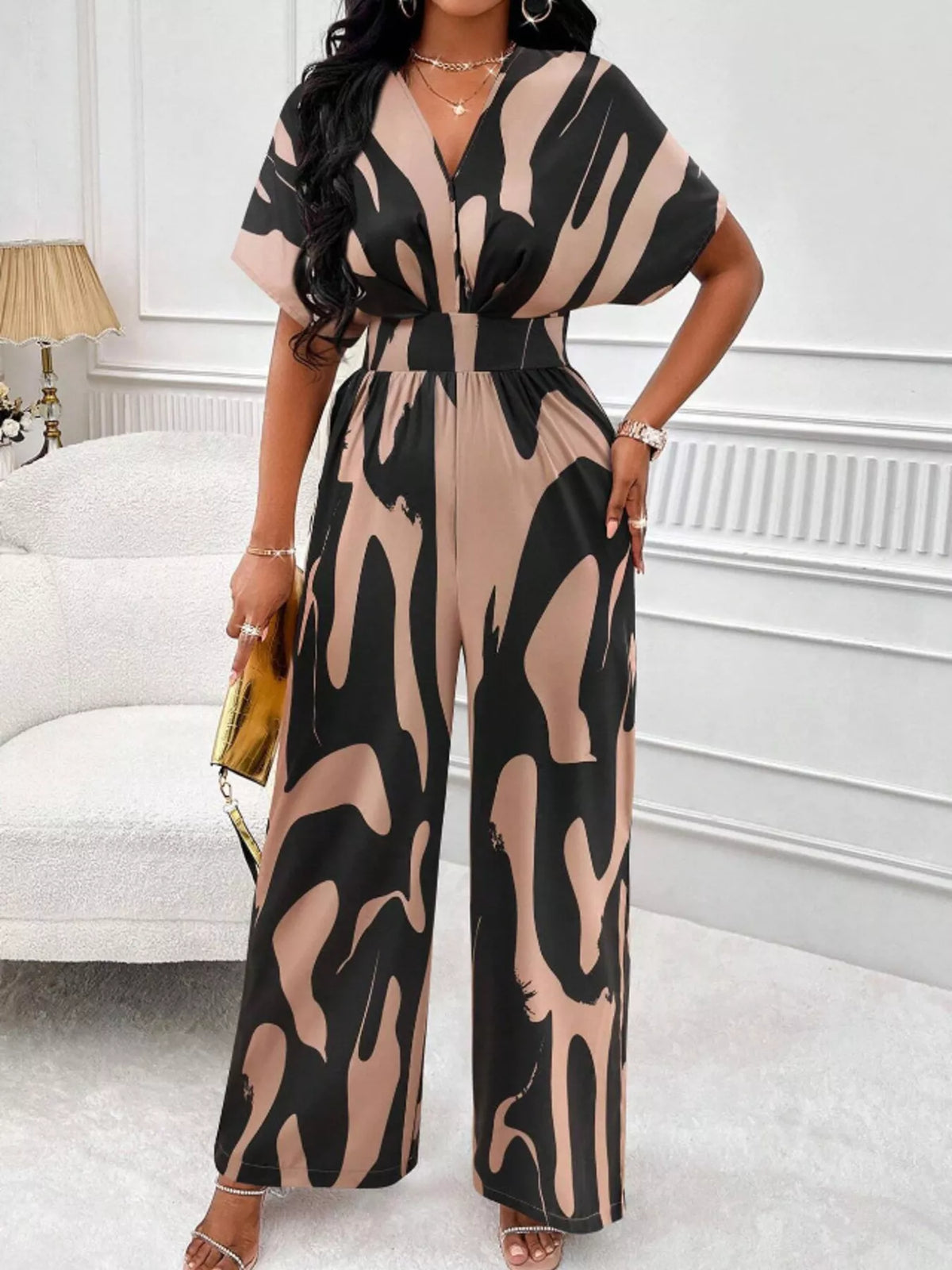 Abstract print wide leg jumpsuit with ruched bodice close up view